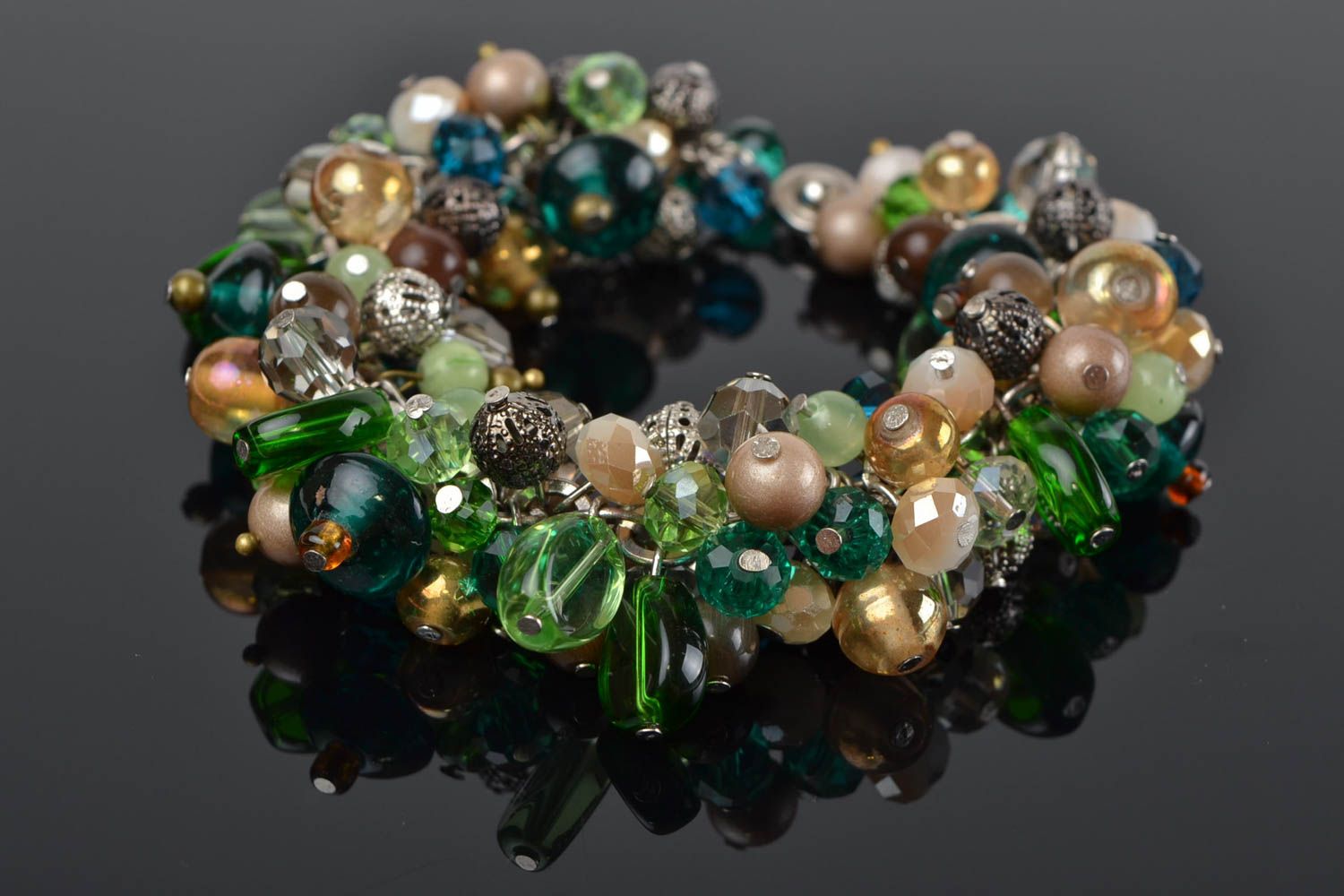 Handmade wrist bracelet with nephrite and cat's eye stone beads in green shades photo 1