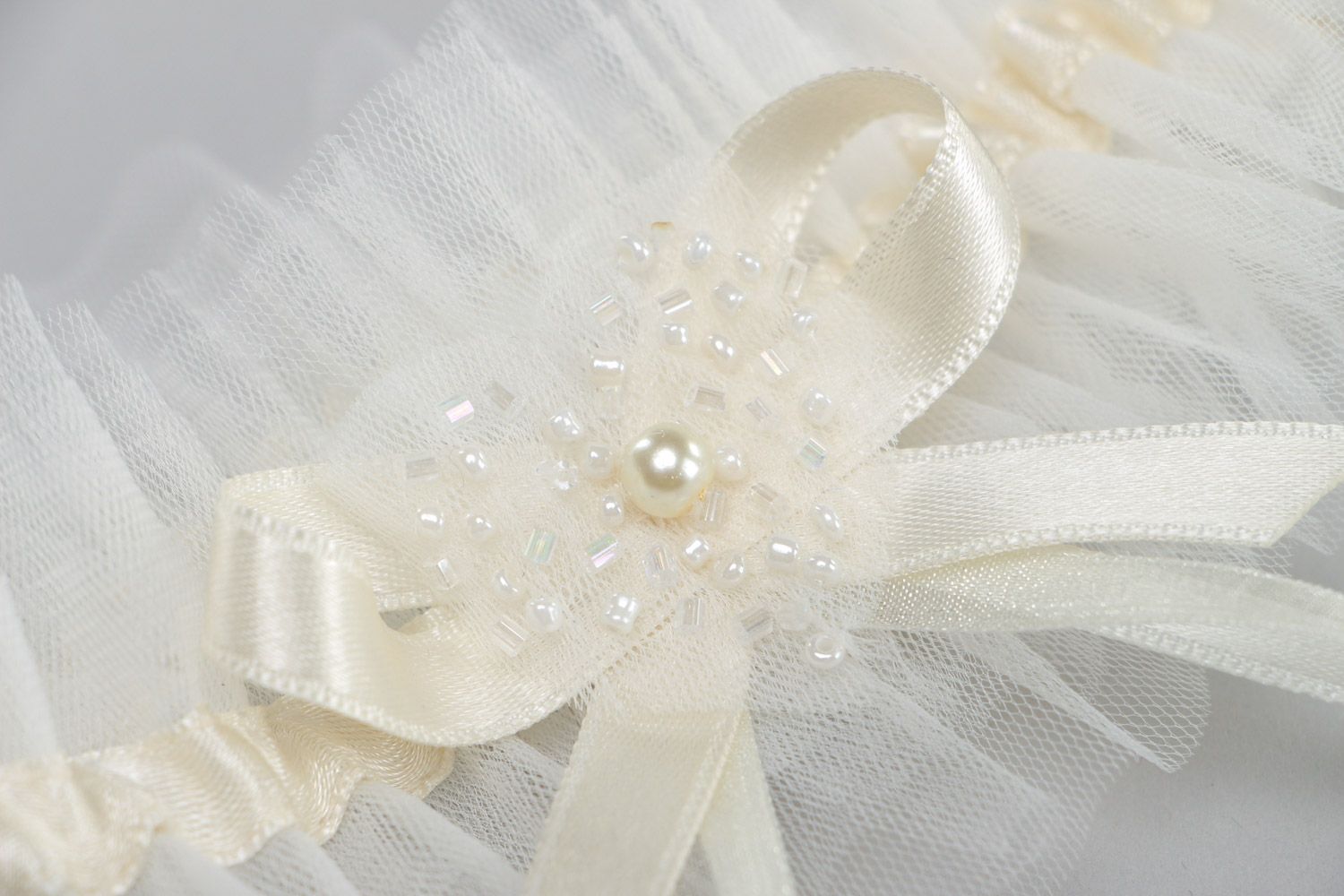 Handmade ivory colored veiling wedding bridal garter with satin ribbon and pearl photo 4