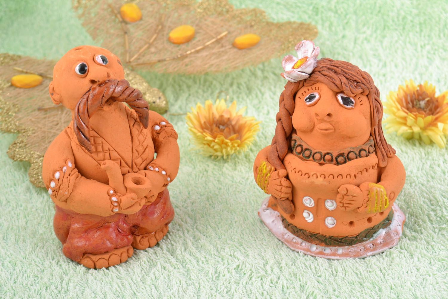 Handmade decorative figurines made of clay woman and man brown funny statuettes photo 1