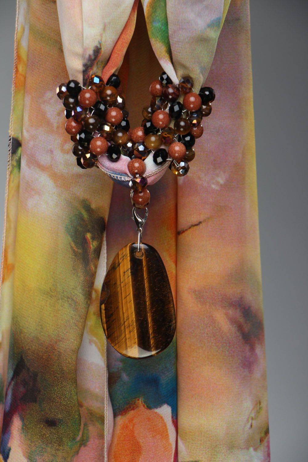 Thin scarf with a tiger's eye stone and crystal glass photo 4
