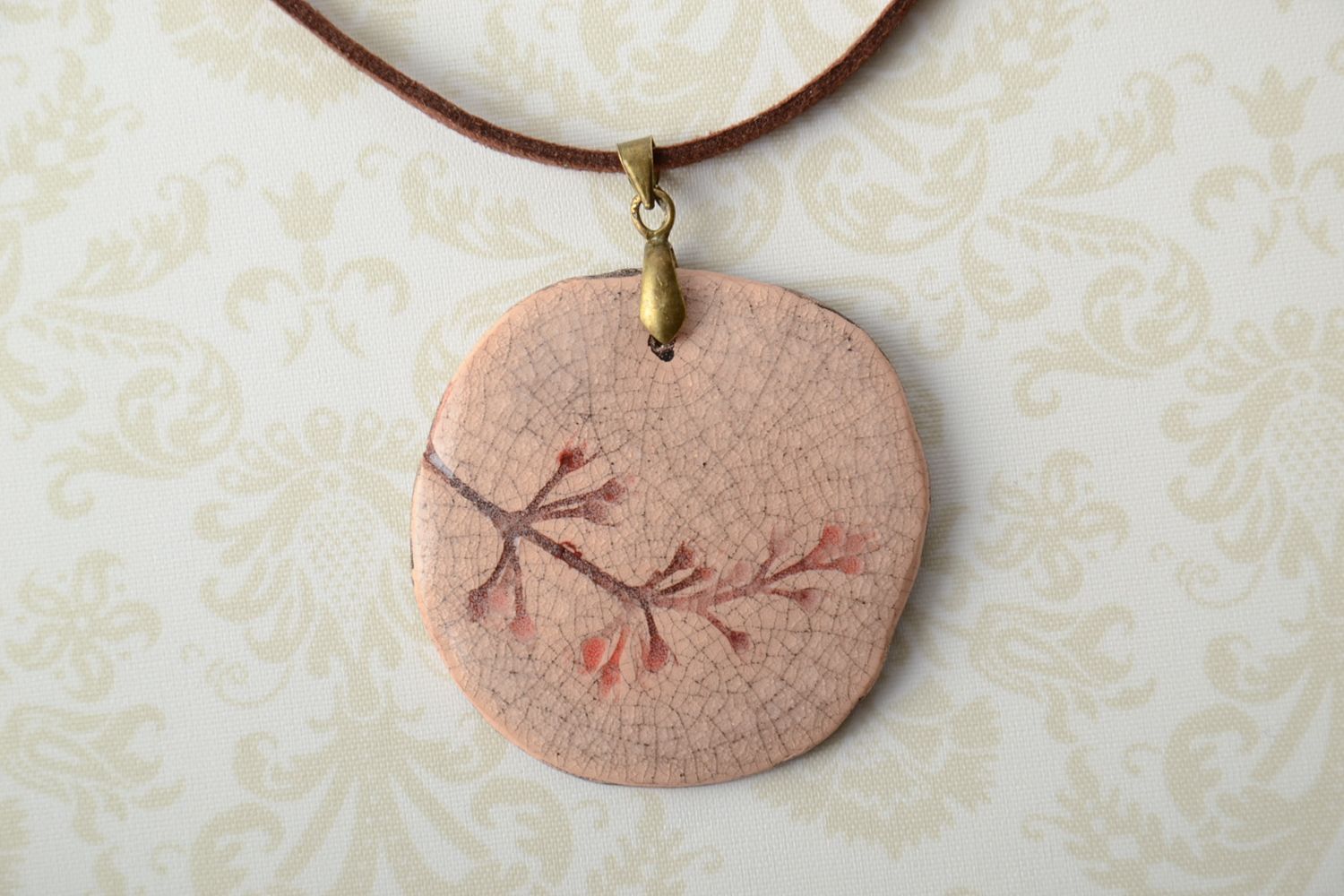 Handmade round pendant with floral stamps photo 1