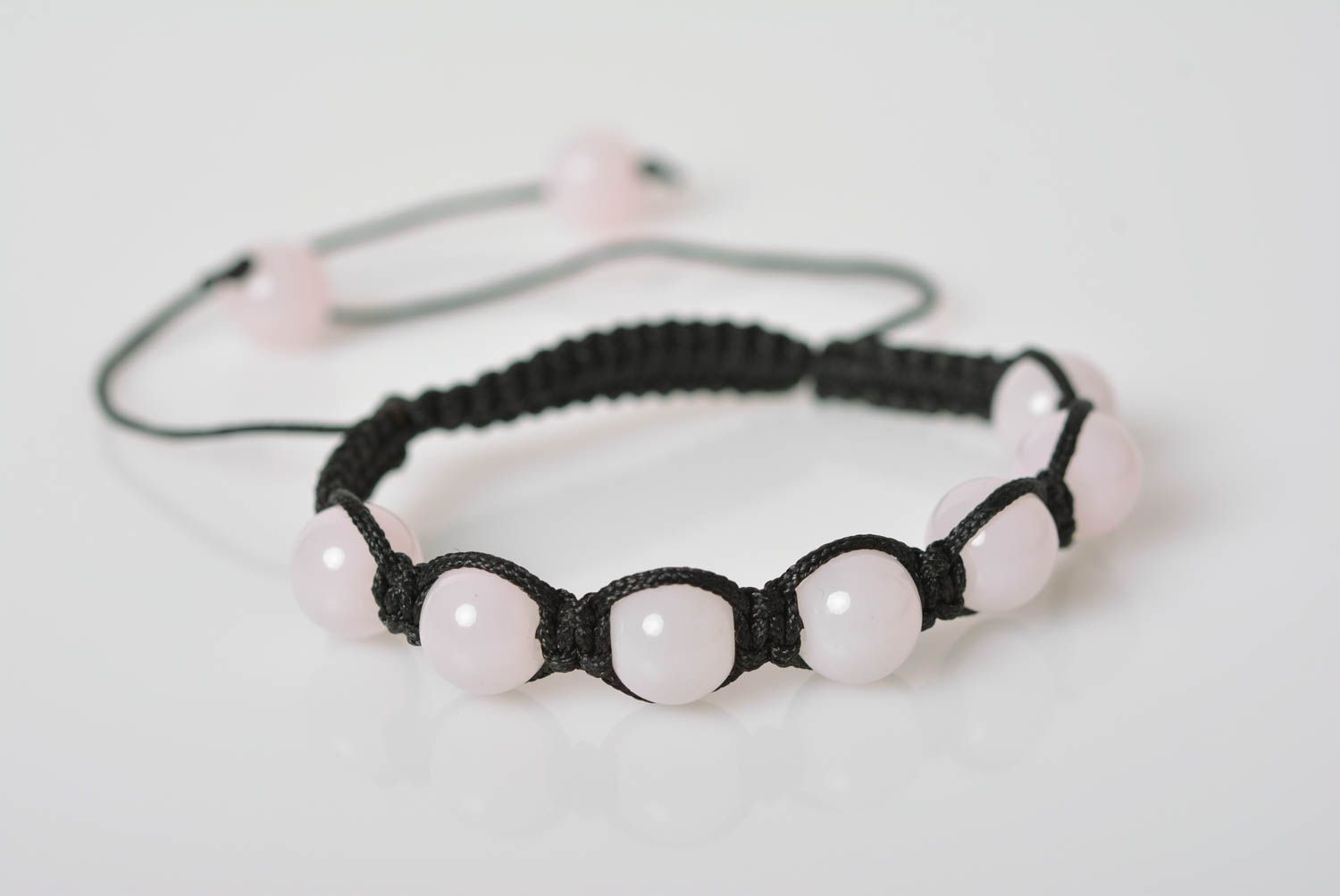White handmade beautiful bracelet made of glass beads with adjustable size photo 3
