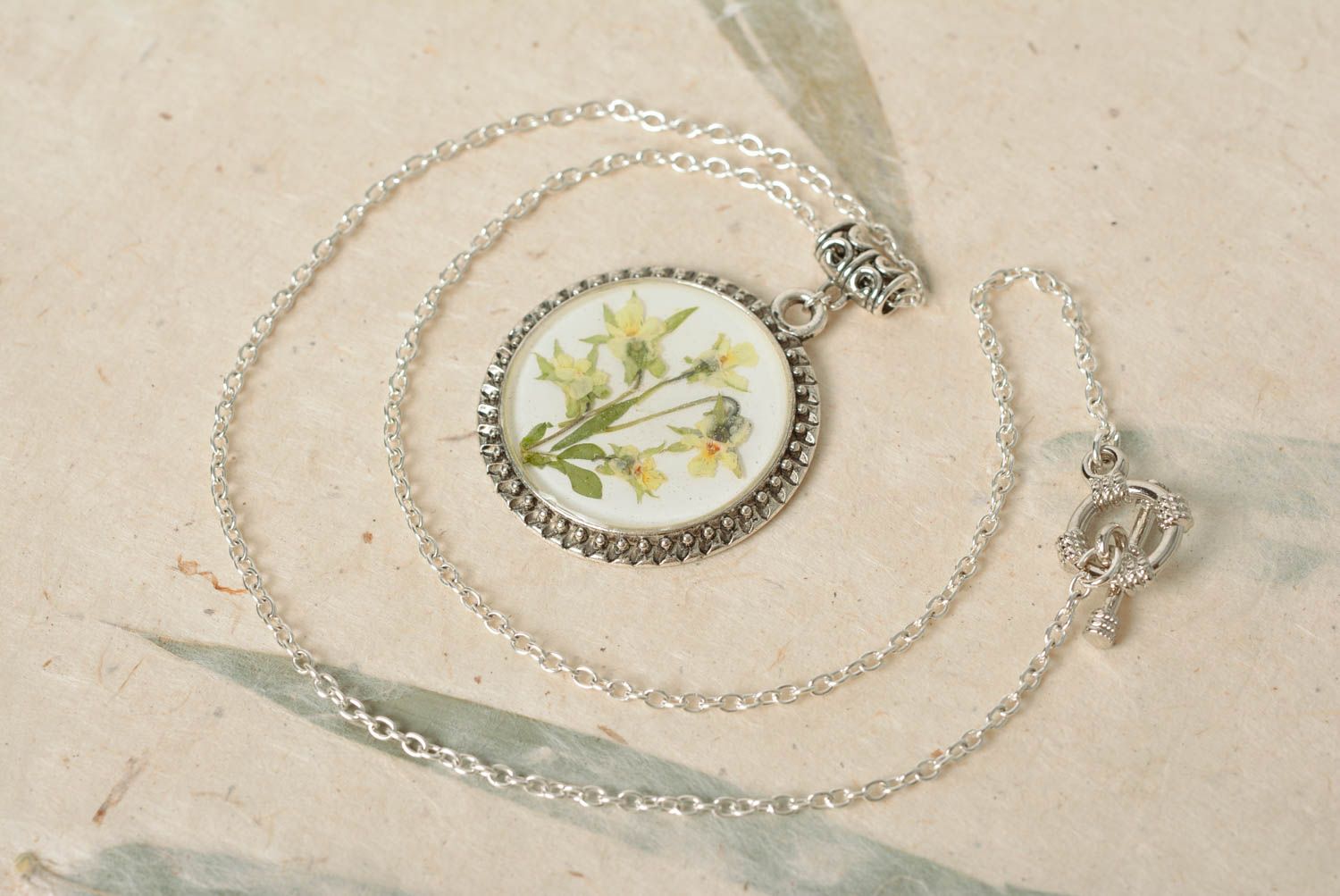 Handmade round metal vintage pendant with real flowers in epoxy resin on chain photo 1