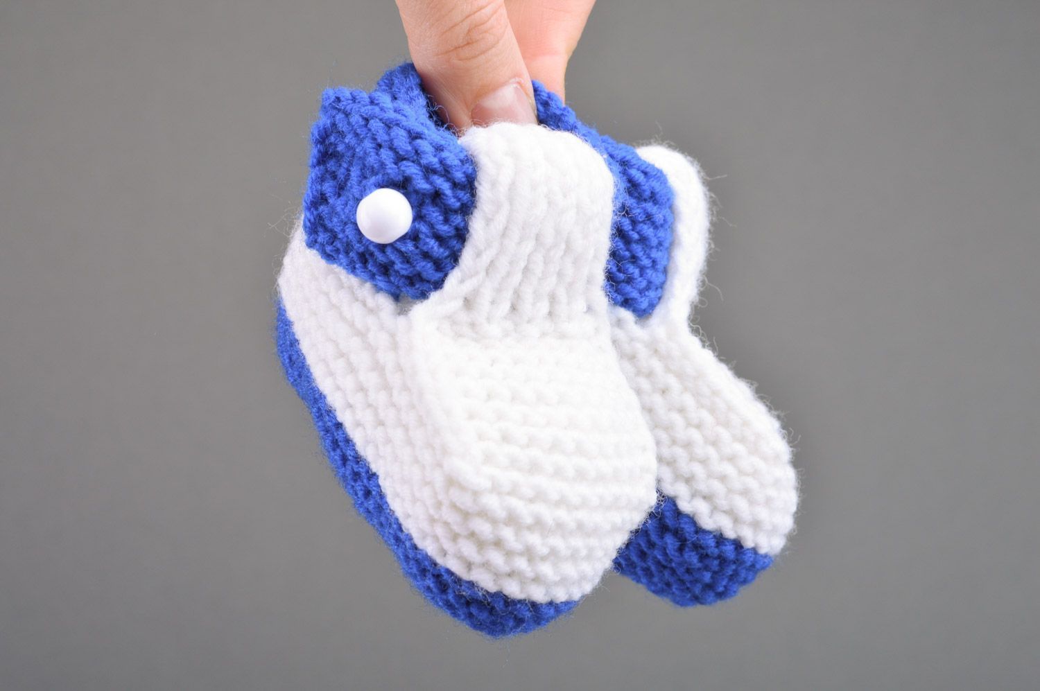 Small handmade knitted baby booties of white and blue colors for boy photo 3