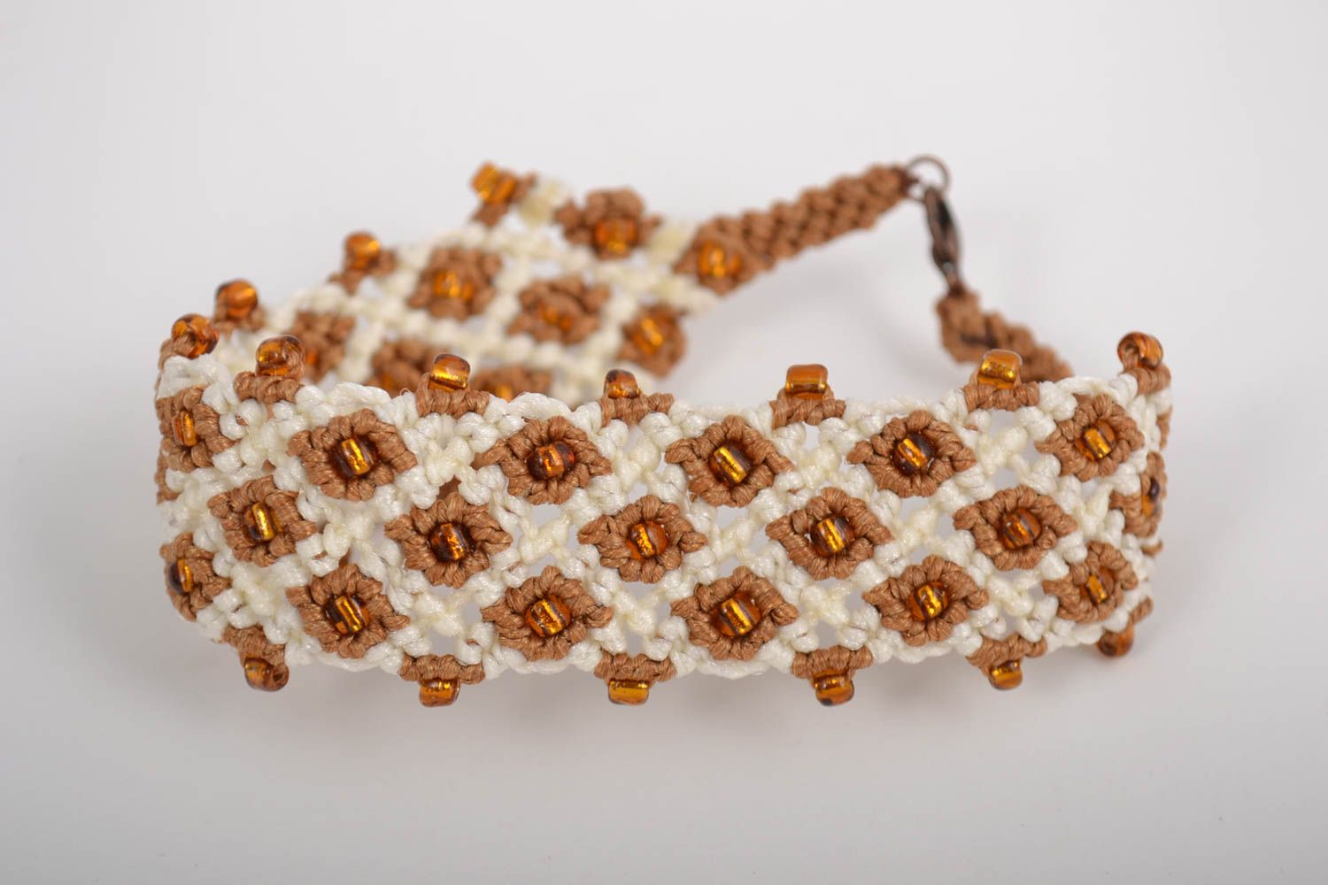 Handmade designer macrame wrist bracelet woven of synthetic threads with beads photo 2