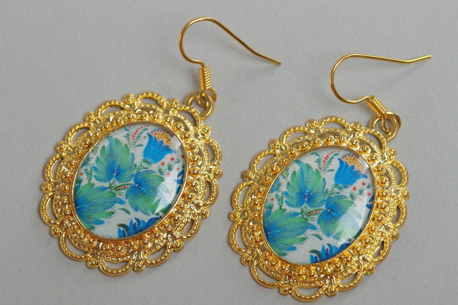 Handmade oval floral earrings with golden colored metal basis and glass glaze photo 2