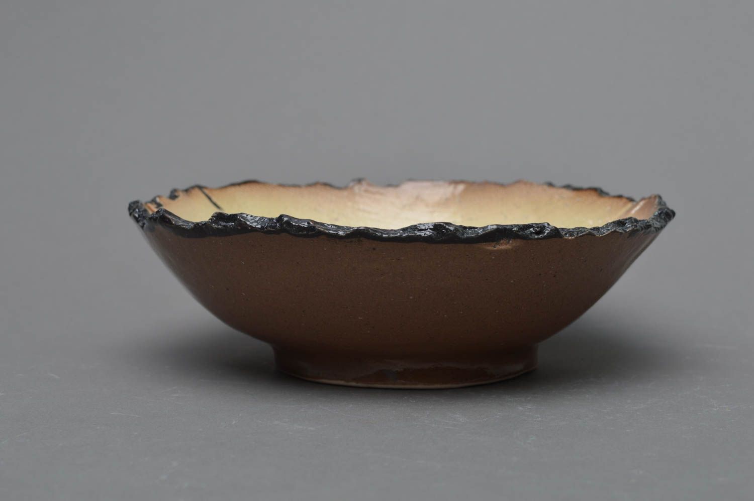 Handmade designer brown and beige glazed porcelain bowl with ragged edge photo 3
