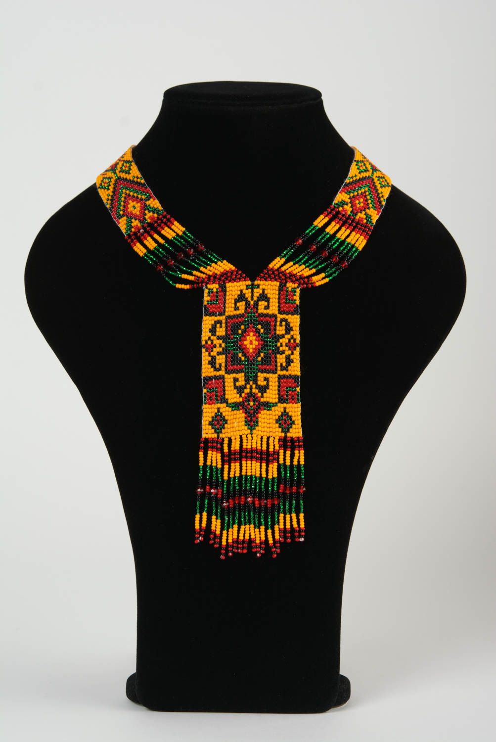 Collar hecho a mano de abalorios de estilo étnico artesanal largo anaranjado foto 2