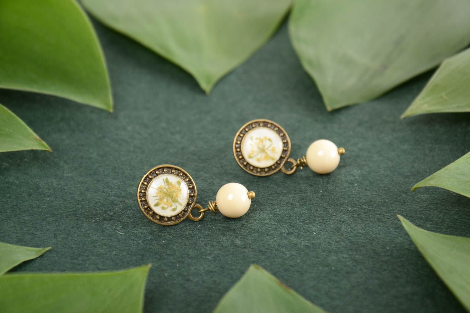 Handmade round epoxy resin earrings with beads on the basis of the brass photo 1