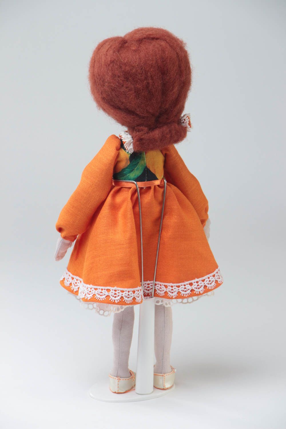 Handmade designer fabric soft doll in orange dress with thin lace on stand photo 4