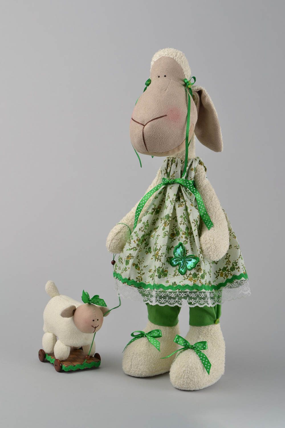 Handmade designer interior fabric soft toy Lamb in green dress with wheeled toy photo 3