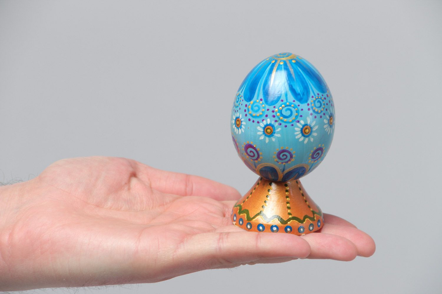Handmade decorative blue painted wooden egg on stand for Easter decoration photo 5