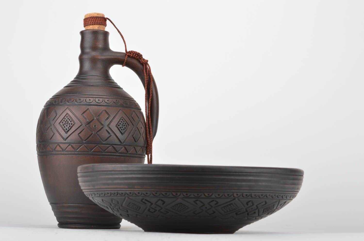 Set of handmade pottery kitchenware dark ceramic bottle with cork and fruit bowl photo 2