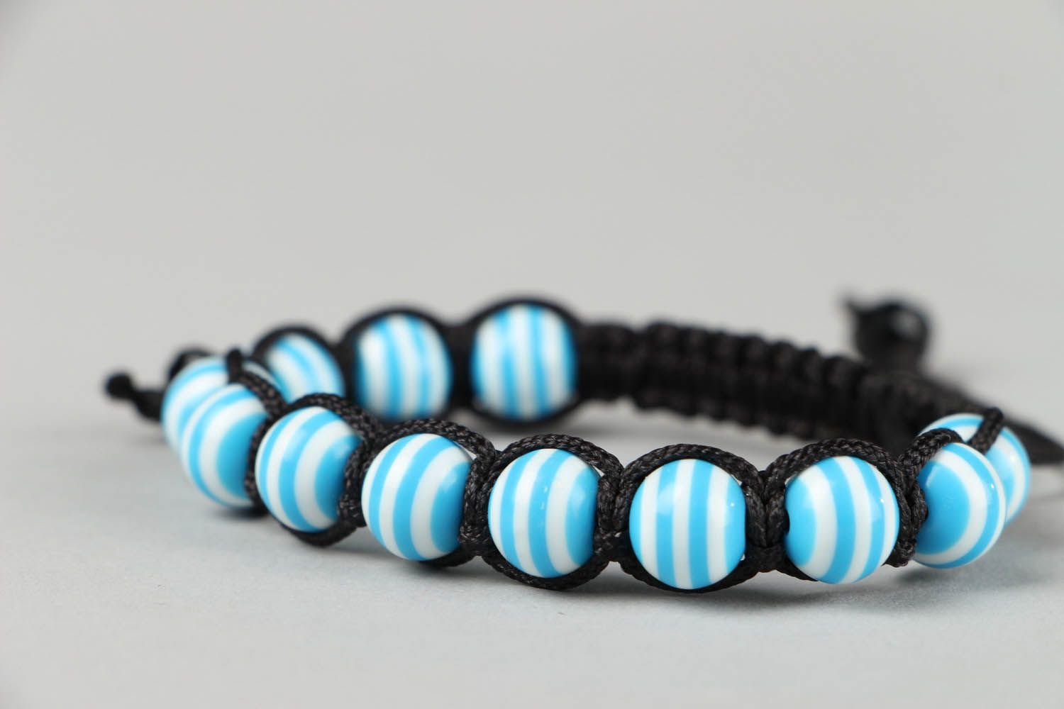 Braided bracelet with beads photo 1