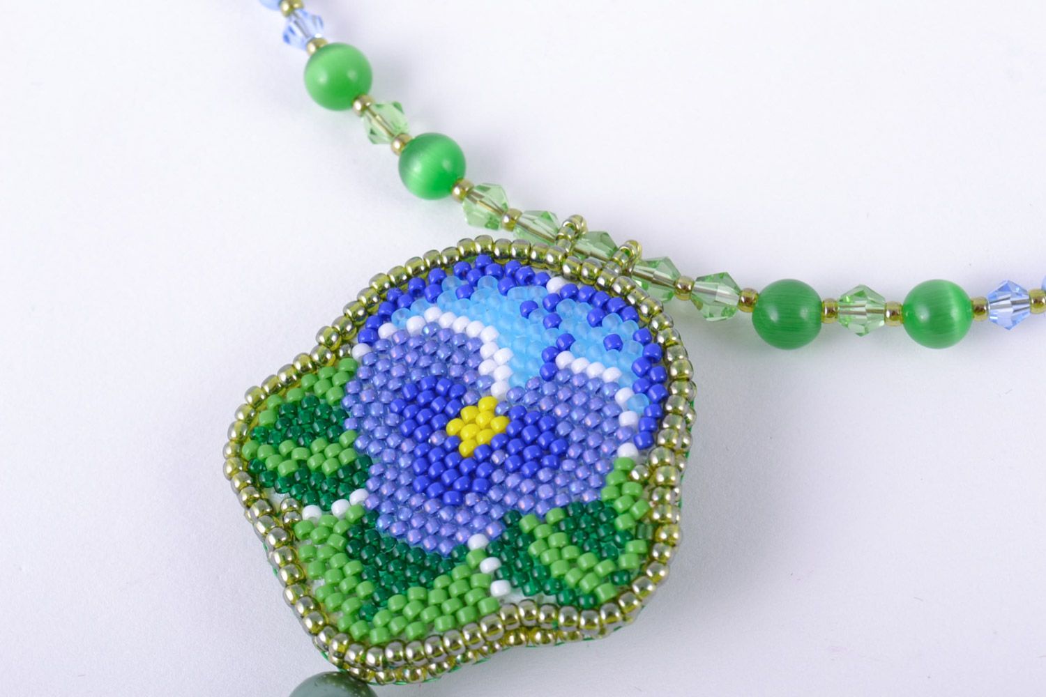 Handmade women's necklace embroidered with beads and natural stones with charm photo 3