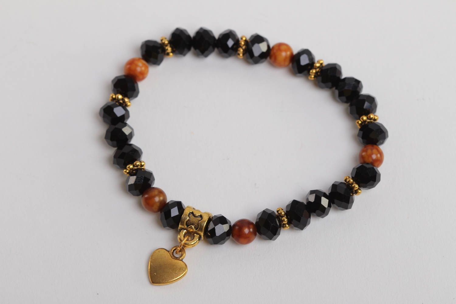 Stretchy beaded  black and cherry beads  gemstone bracelet with heart shape centerpiece photo 2
