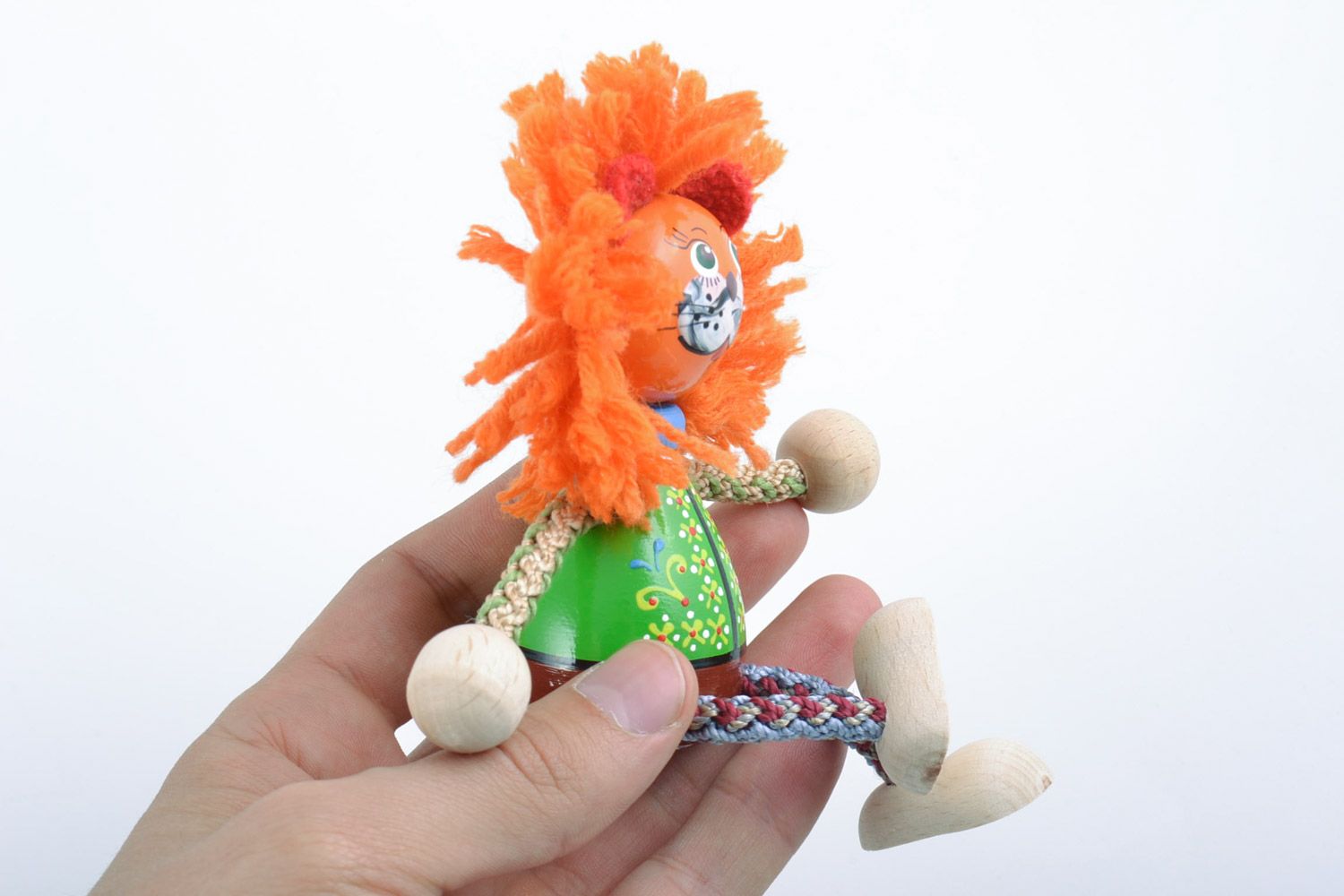 Unusual handmade beautiful wooden toy lion decorated with eco-paints present for children photo 2