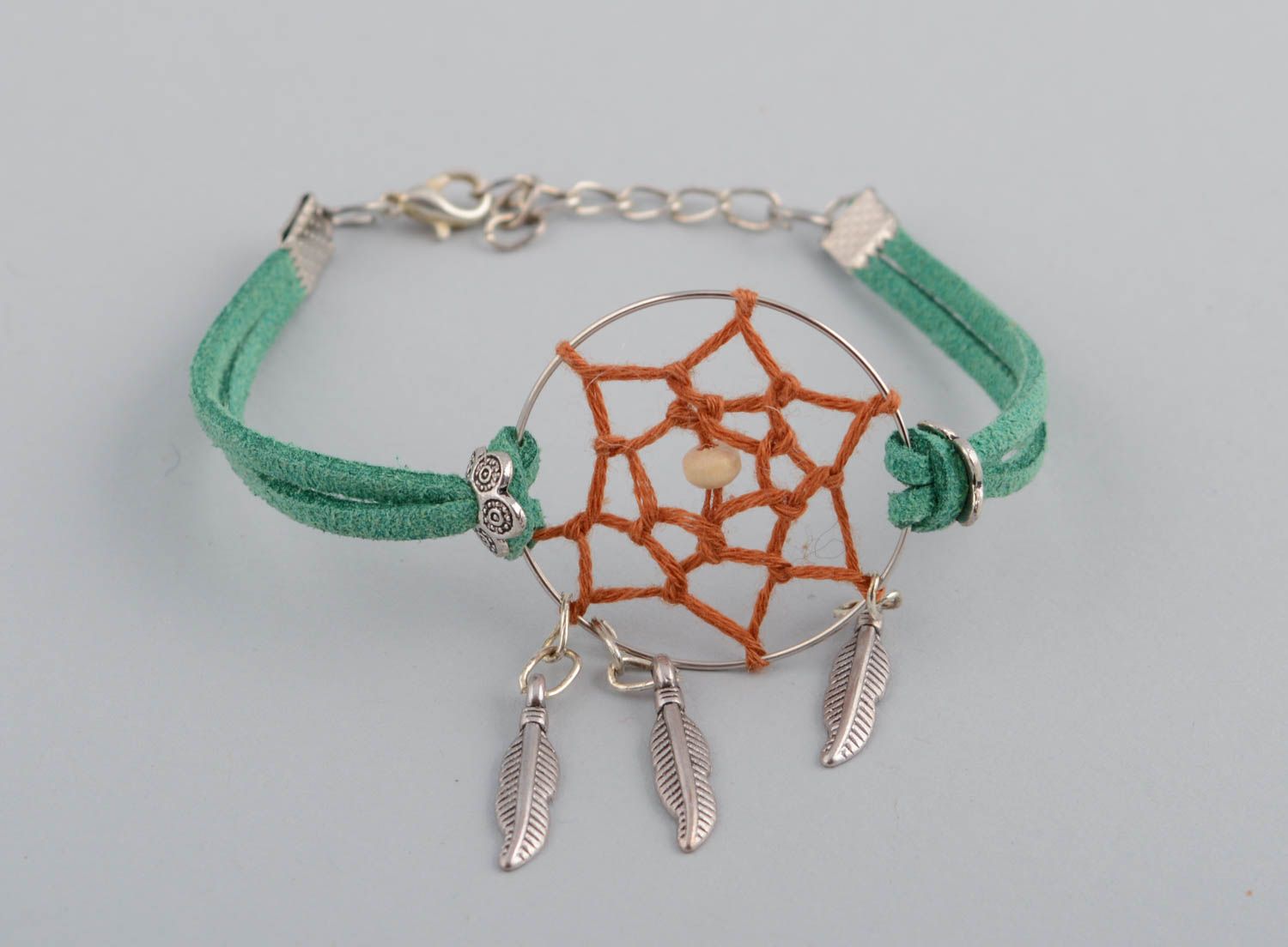 Handmade green faux cord wrist bracelet with metal charms dreamcatcher amulet photo 2