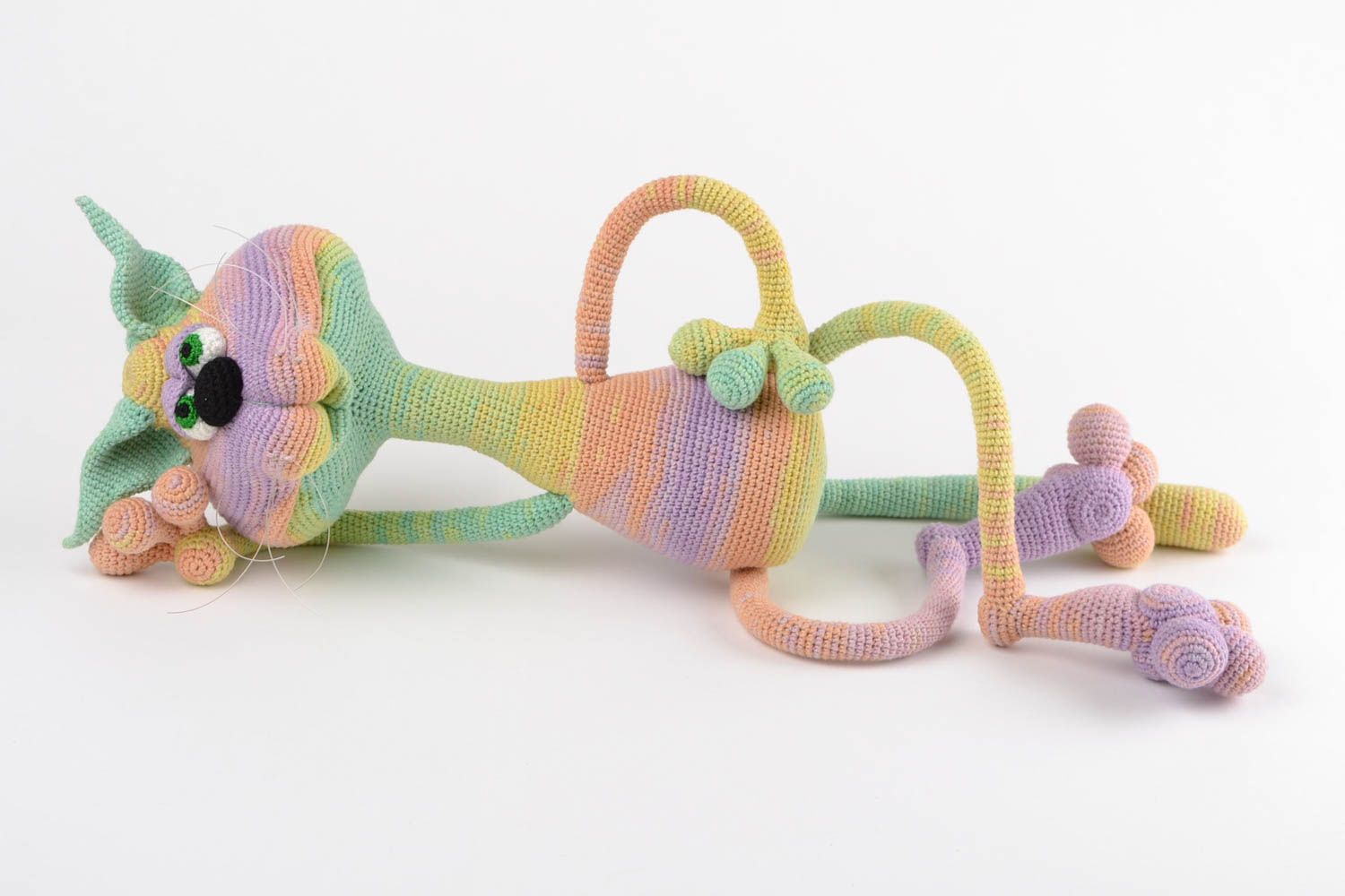 Handmade designer soft toy crocheted of acrylic threads cat of rainbow coloring photo 1