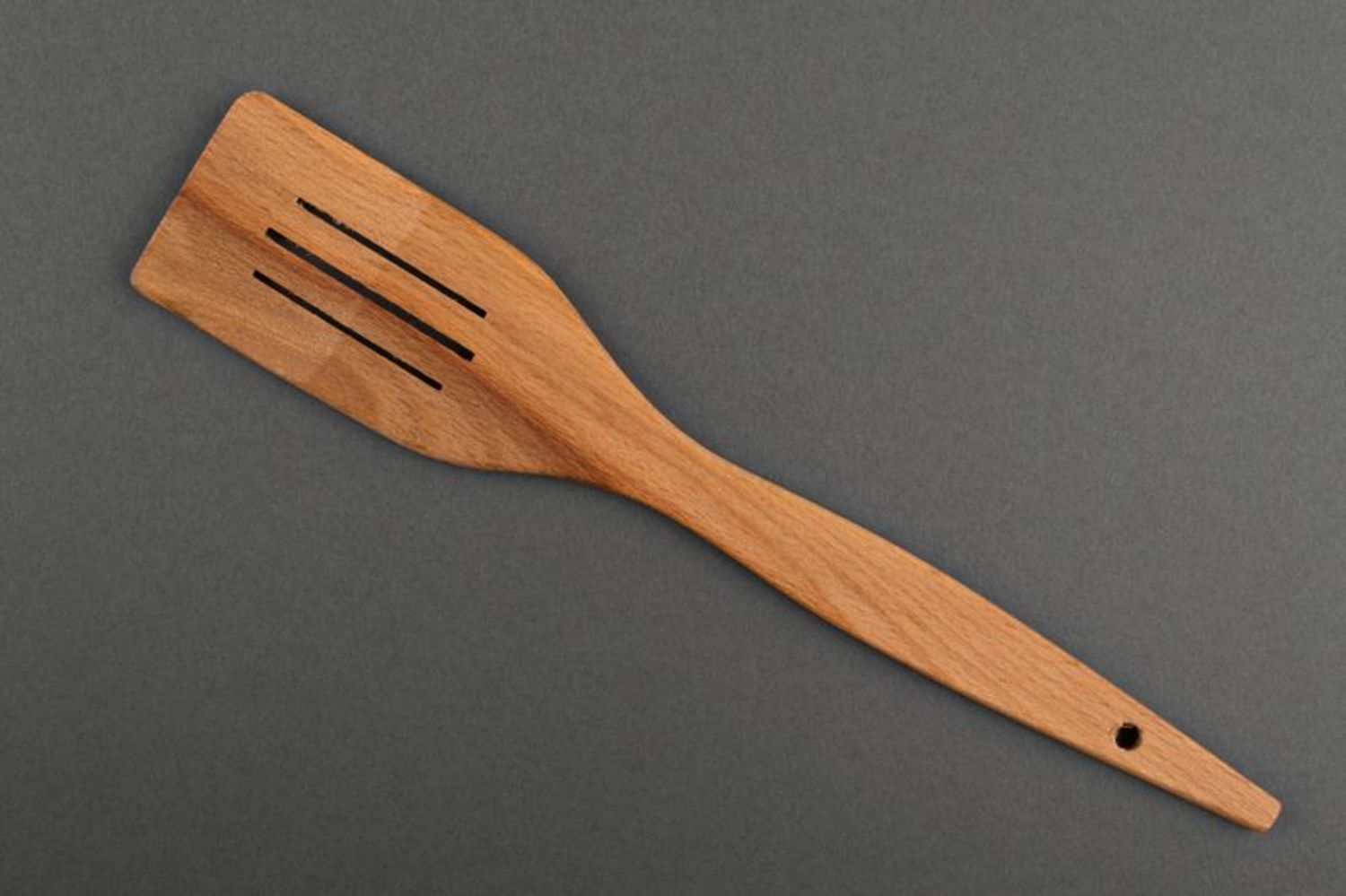 Wooden kitchen spatula with cuts photo 2