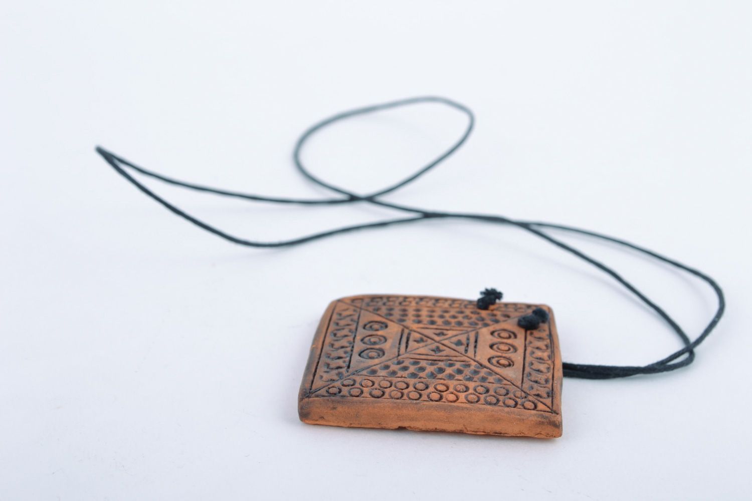 Handmade ceramic pendant with relief ornament in ethnic style and long cord  photo 5