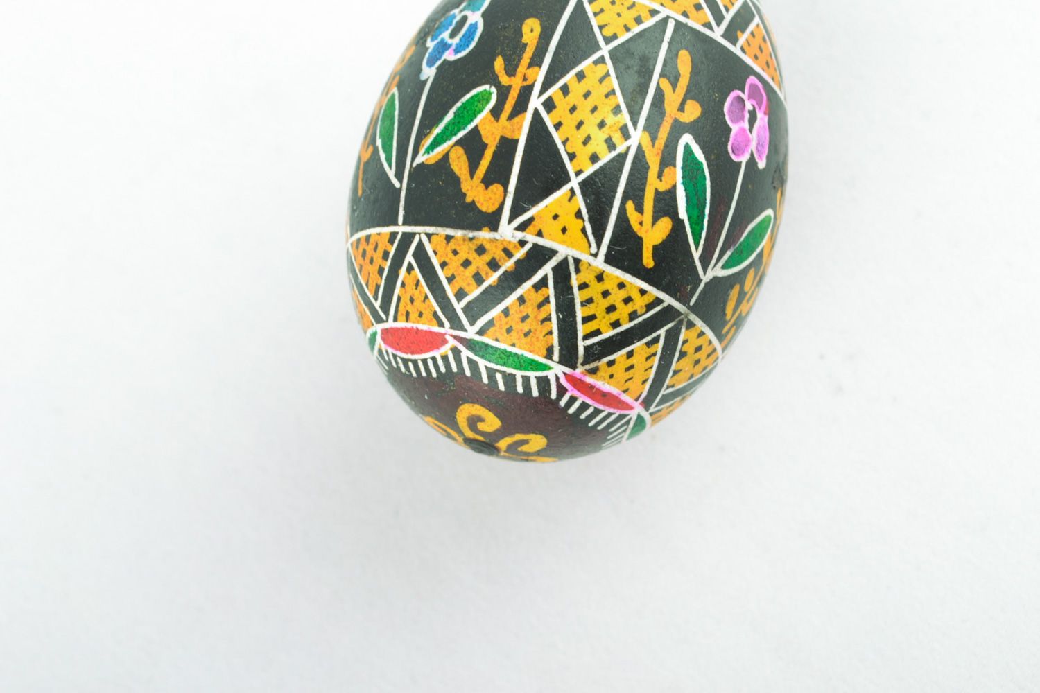 Colorful ornamented art Easter egg with handmade painting on black background photo 4