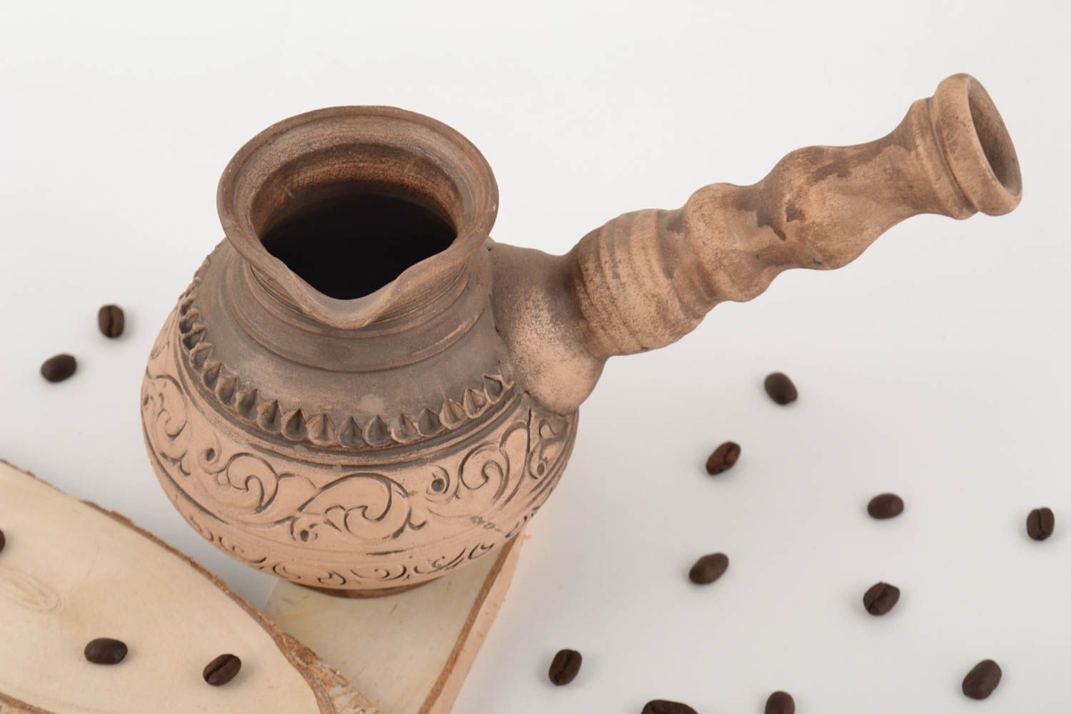 Ceramic unusual brown handmade ibrik with ornaments with bulk of 500 ml photo 1