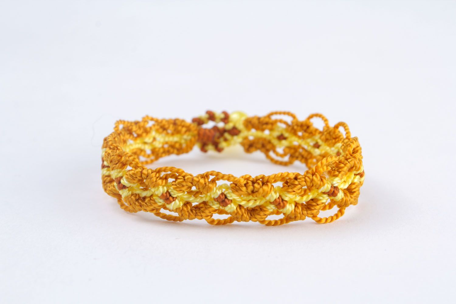 Yellow bracelet made using macrame weaving technique photo 4