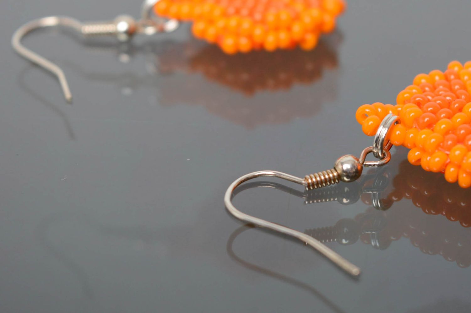 Round beaded earrings of orange color photo 4