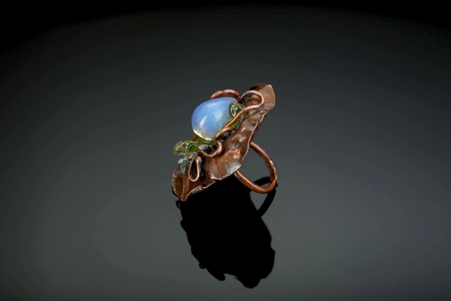 Copper ring with chrysolite photo 2