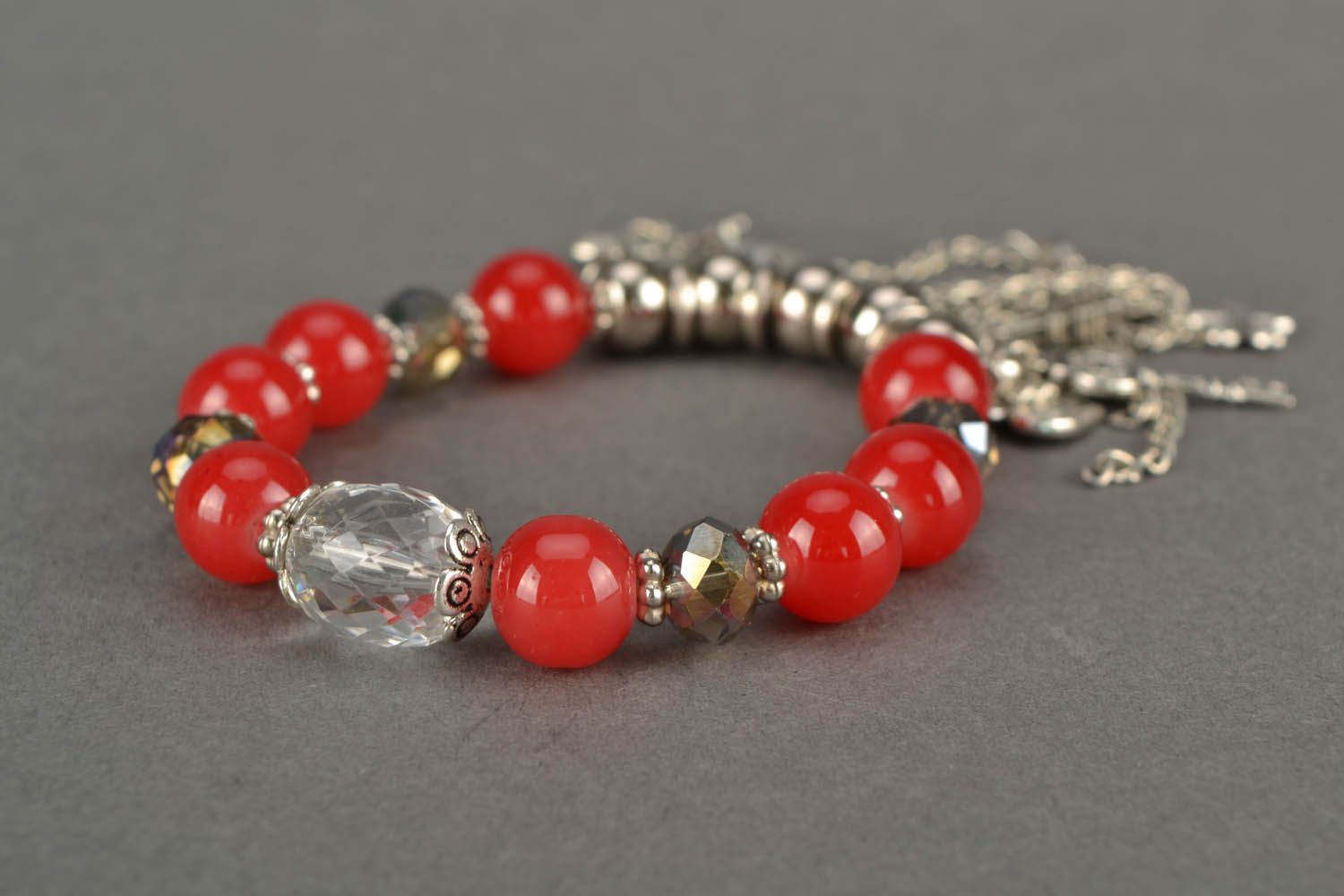 Red bracelet with charms photo 6
