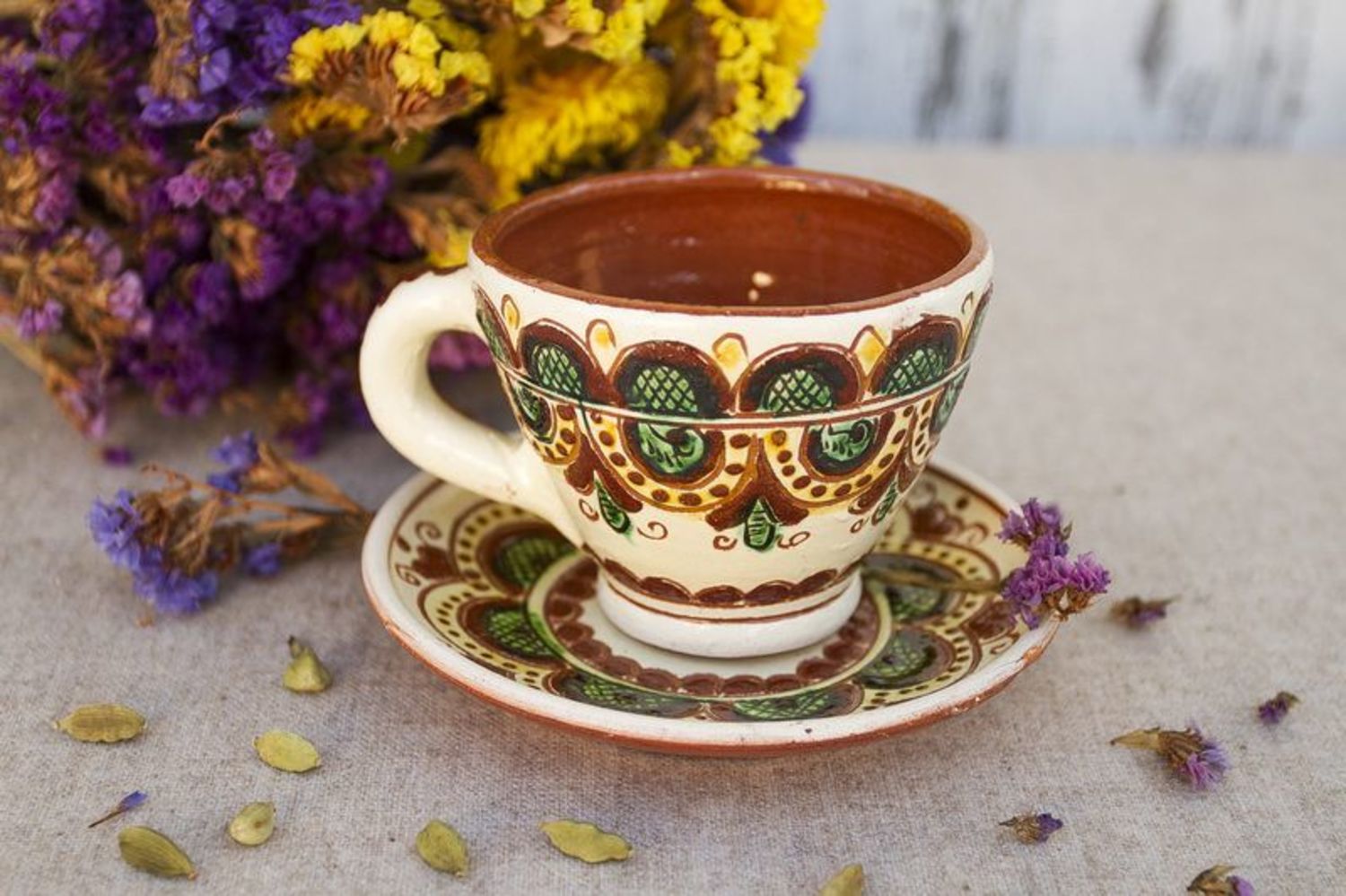 Decorative ceramic coffee cup with a saucer and handle photo 1