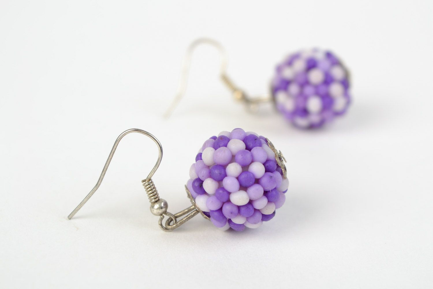 Handmade polymer clay dangling earrings with small balls of lilac color photo 1