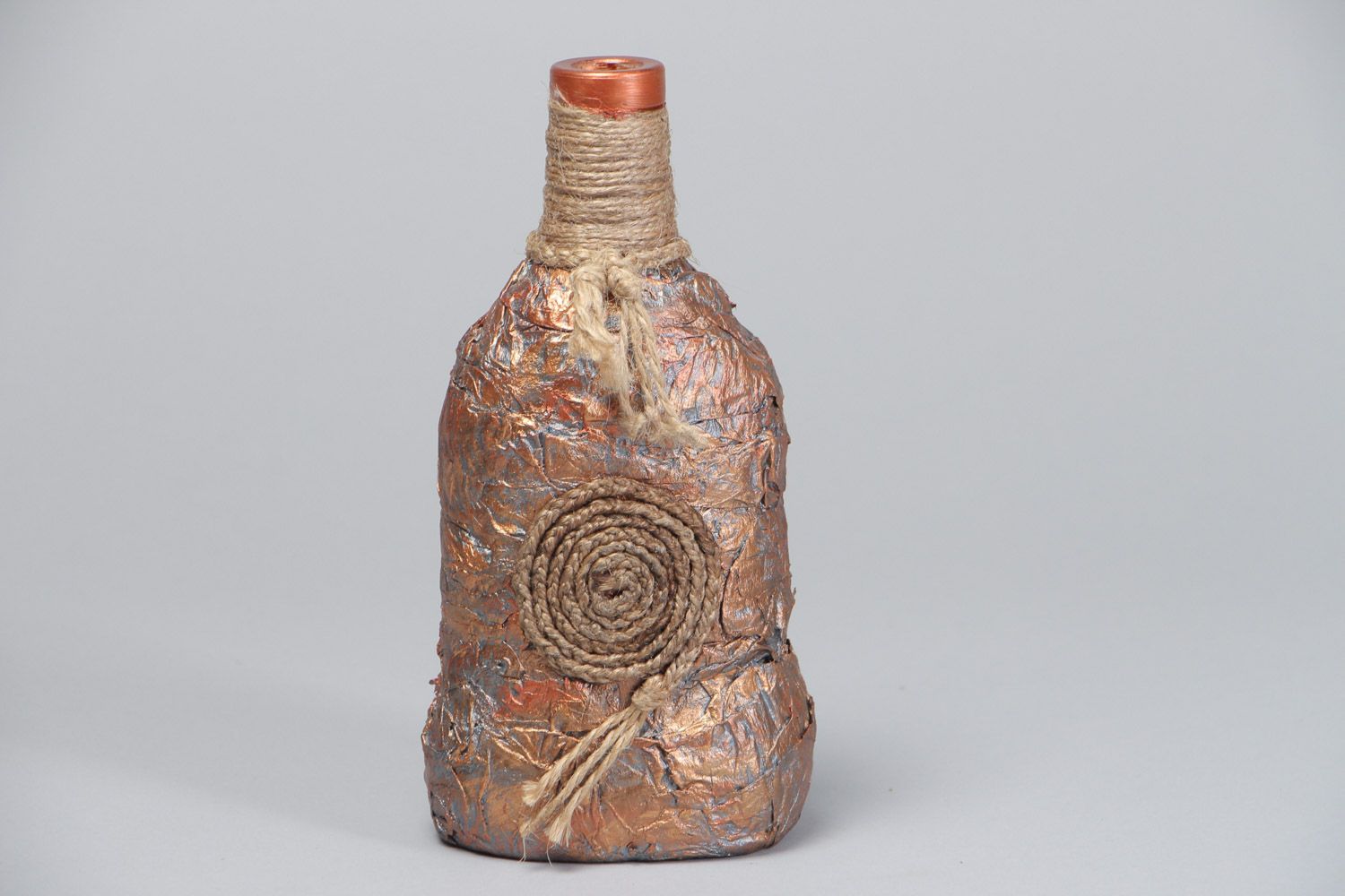 Handmade decorative glass bottle covered with paper and cord in ethnic style photo 2