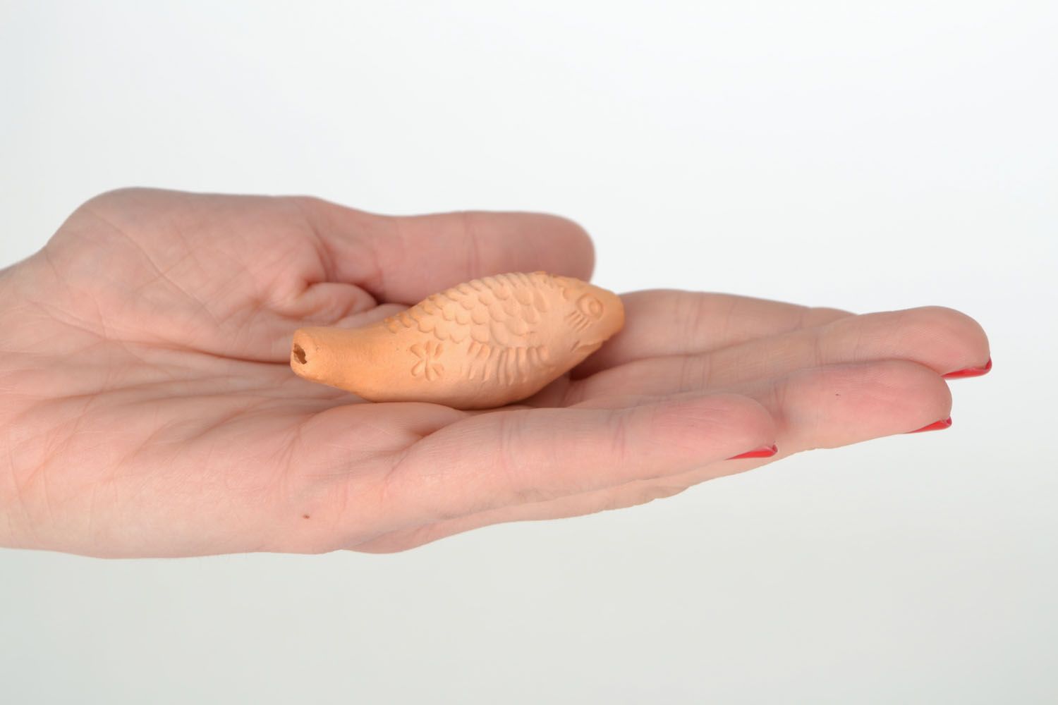 Clay whistle in the form of fish photo 2
