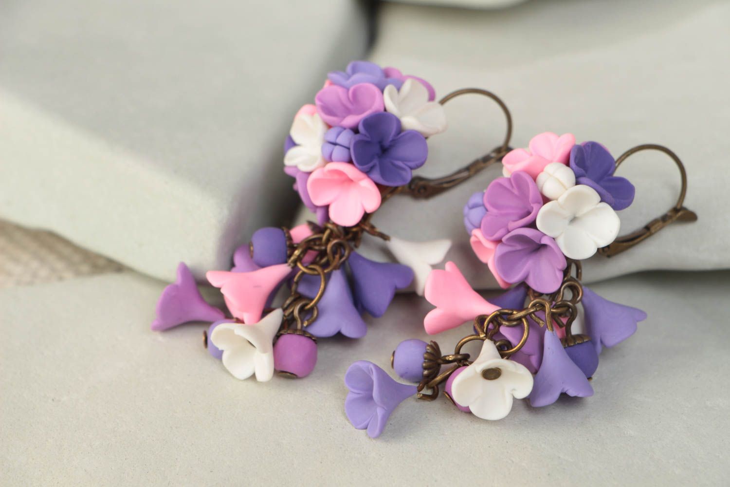 Handmade designer dangle earrings with pink and violet polymer clay flowers photo 1
