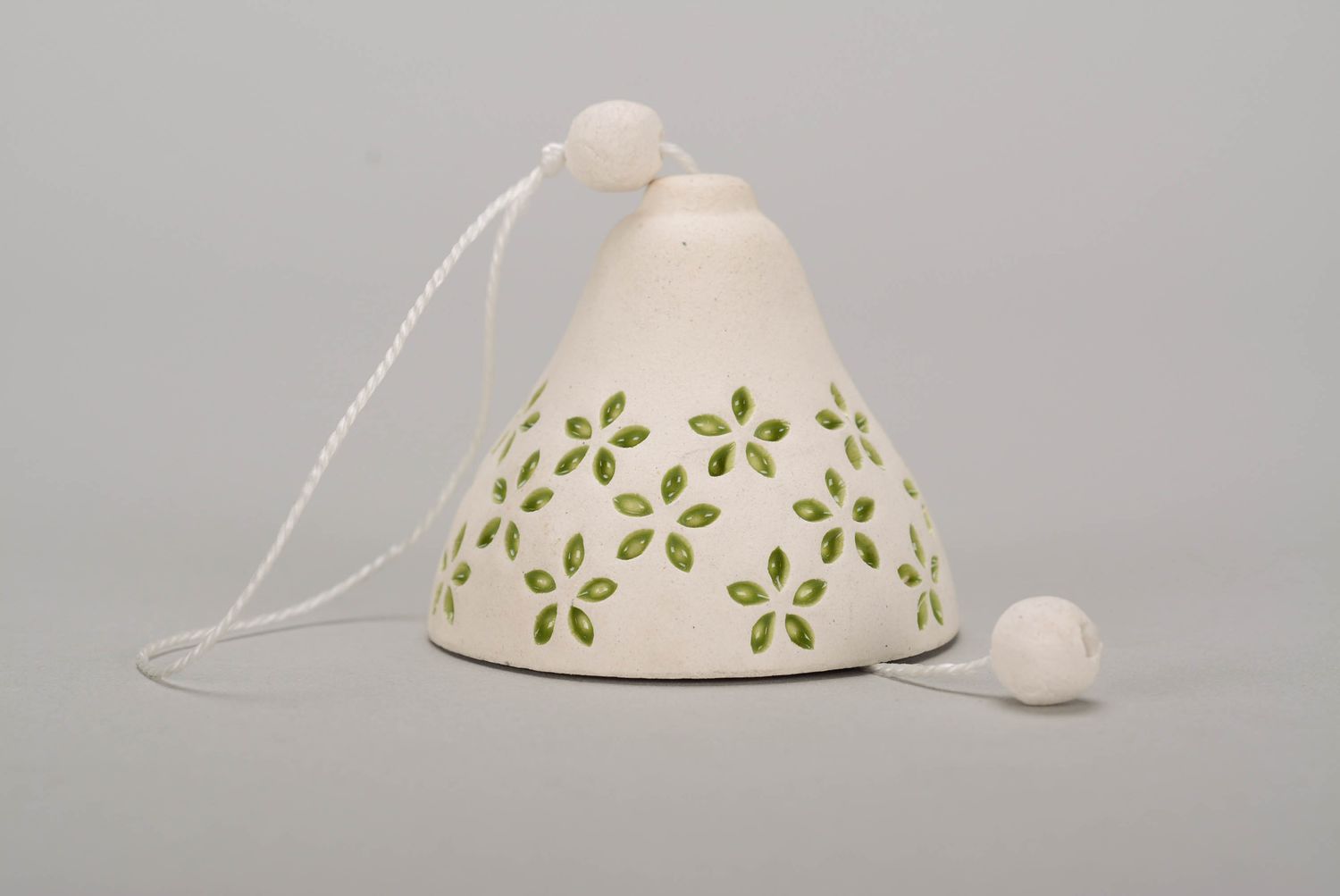 Bell made from white clay photo 1