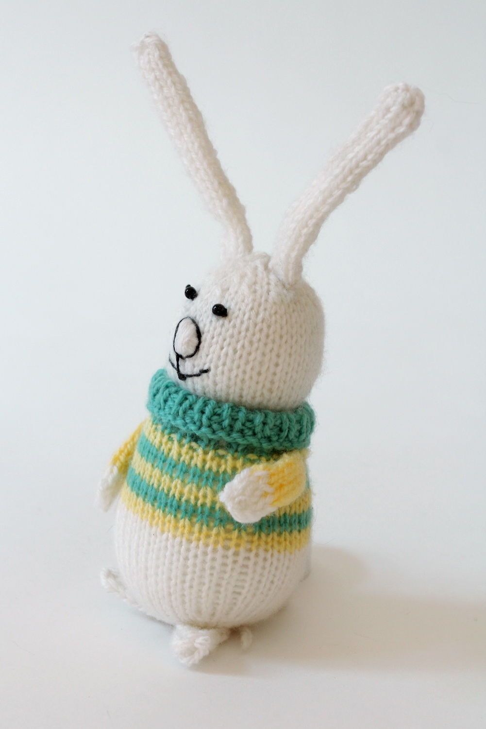 Knitted toy Baby rabbit in yellow-green sweater photo 1