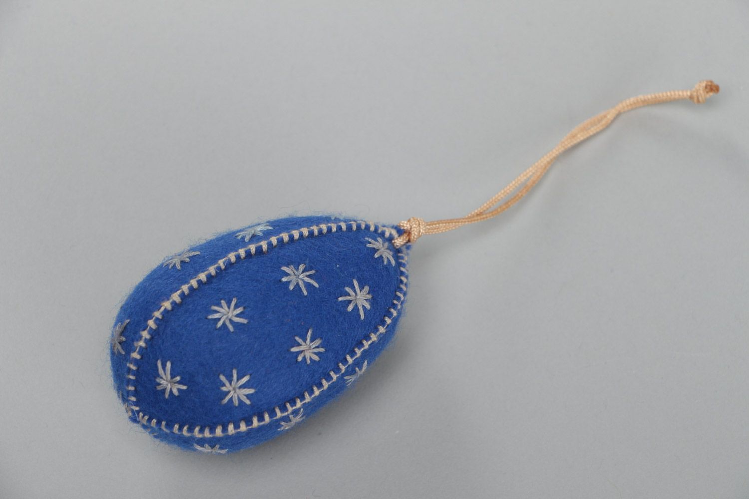 Handmade interior soft wall hanging sewn of blue felt in the shape of Easter egg photo 2