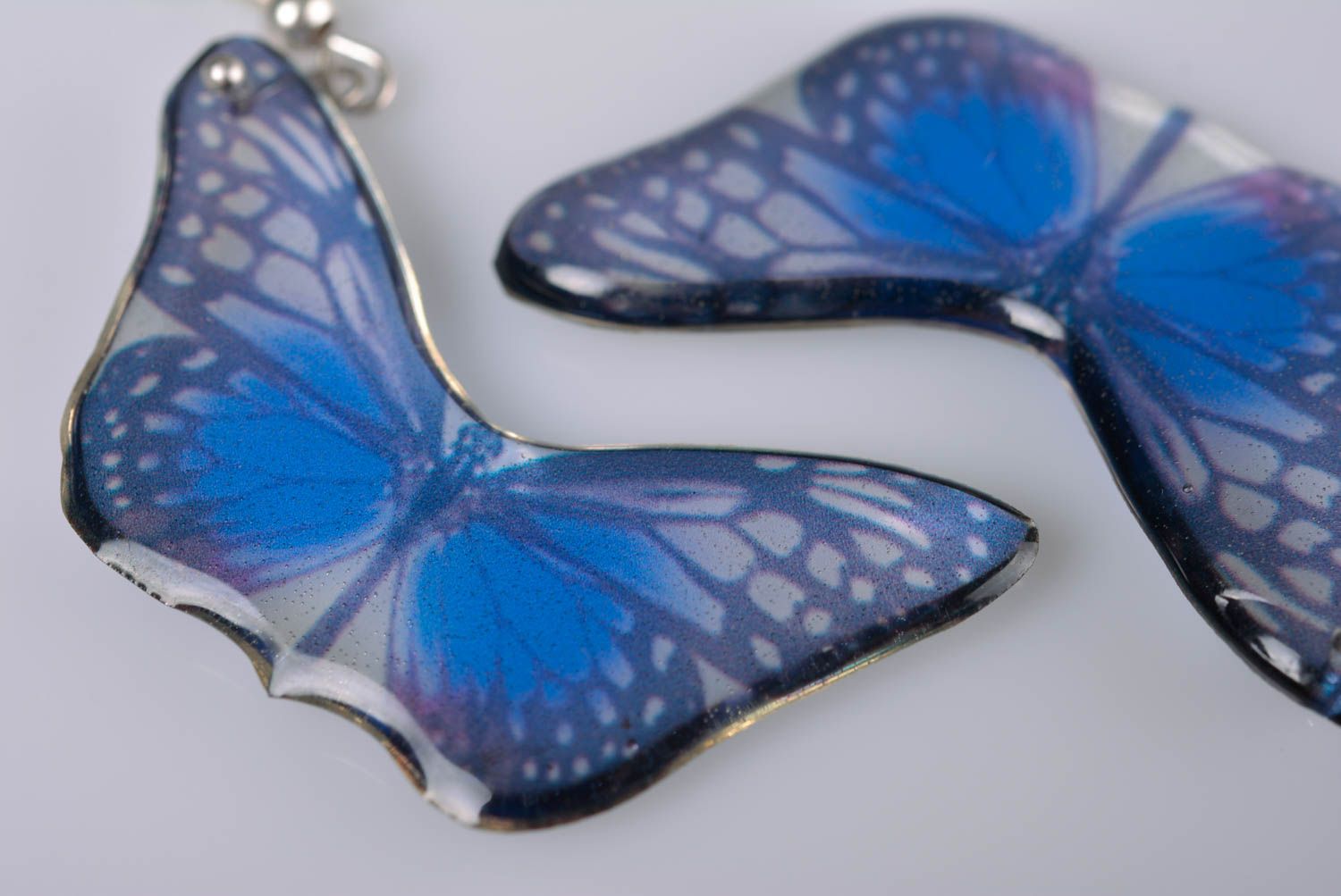 Handmade elegant designer dangling earrings blue butterflies in epoxy resin photo 3
