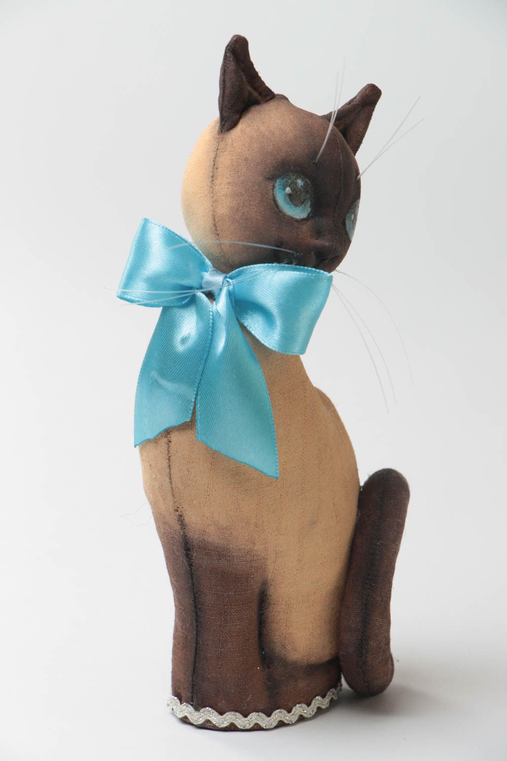 Handmade designer soft toy sewn of primed fabric beautiful cat with blue bow photo 2
