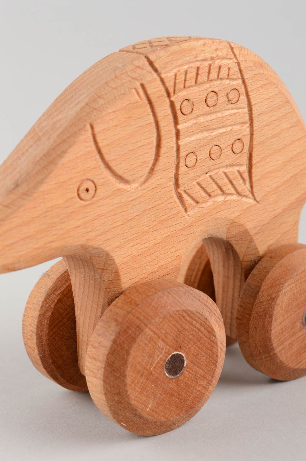 Handmade children's wooden wheeled toy elephant educational photo 5