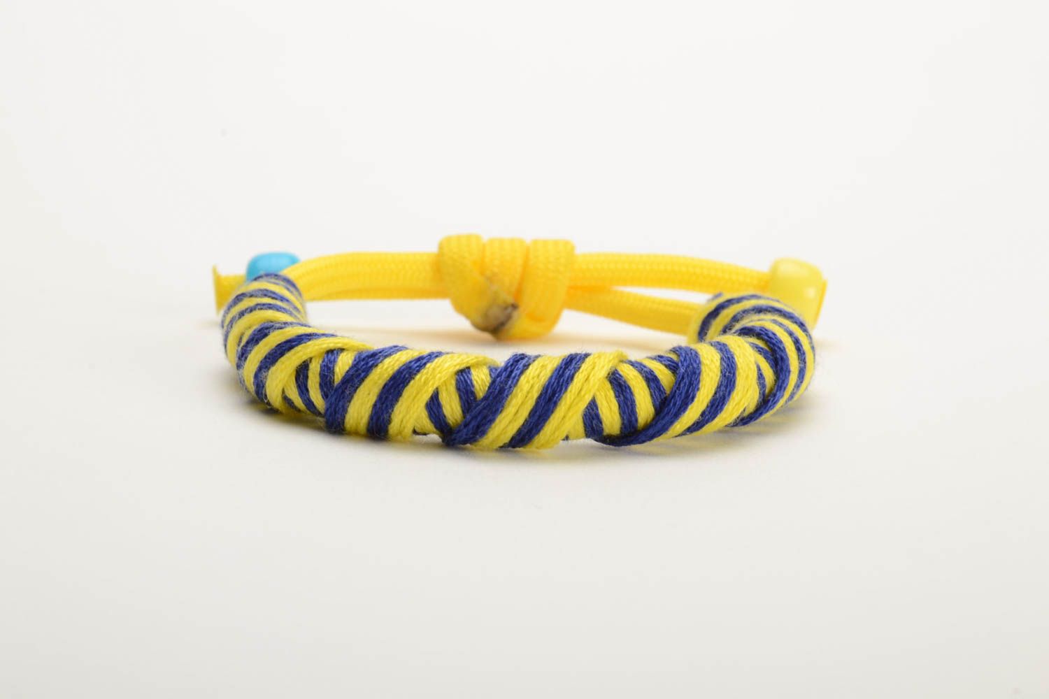 Handmade woven bracelet made of paracord yellow with blue present for friend photo 3