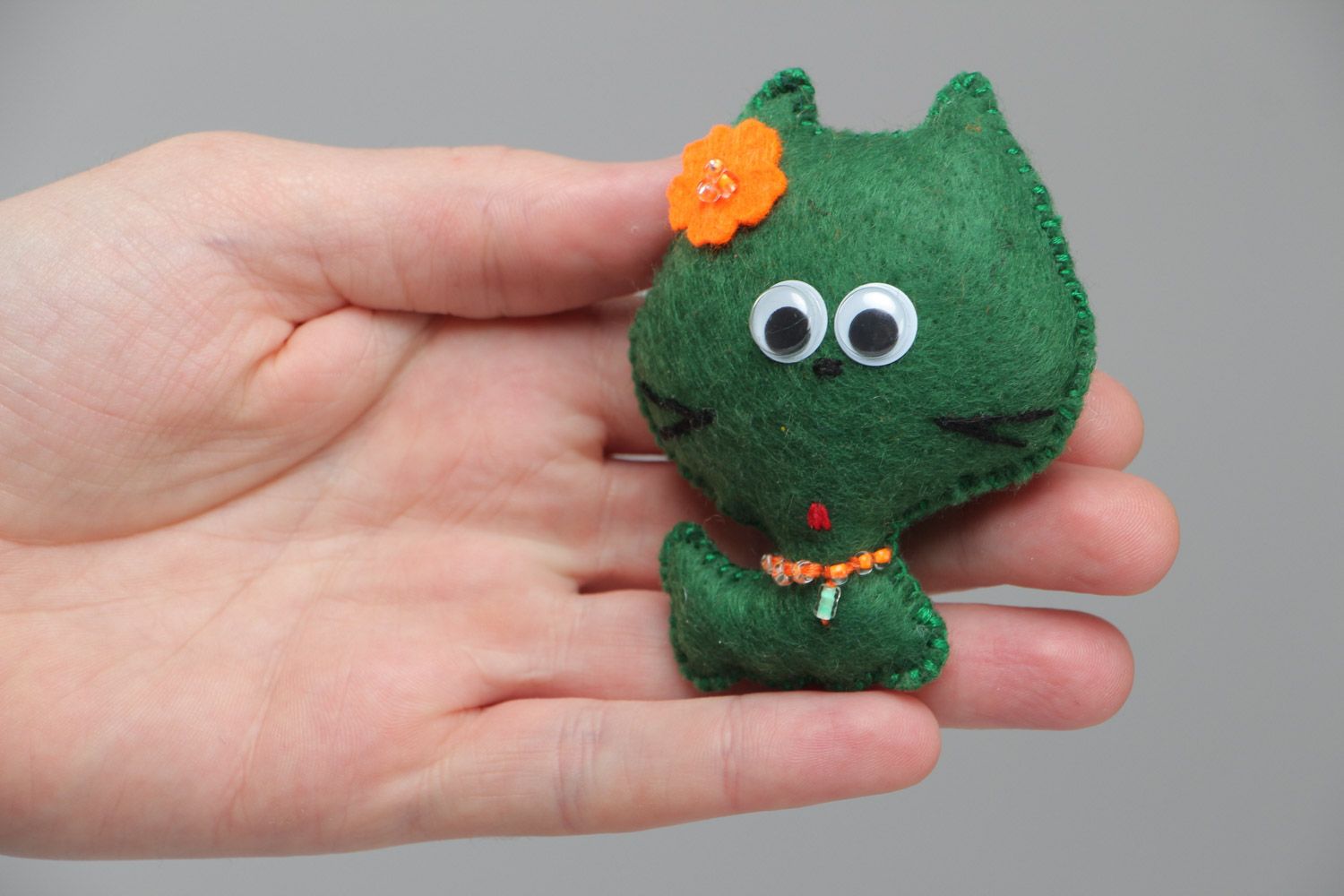 Small cute homemade soft toy sewn of green felt little kitten with orange flower photo 4