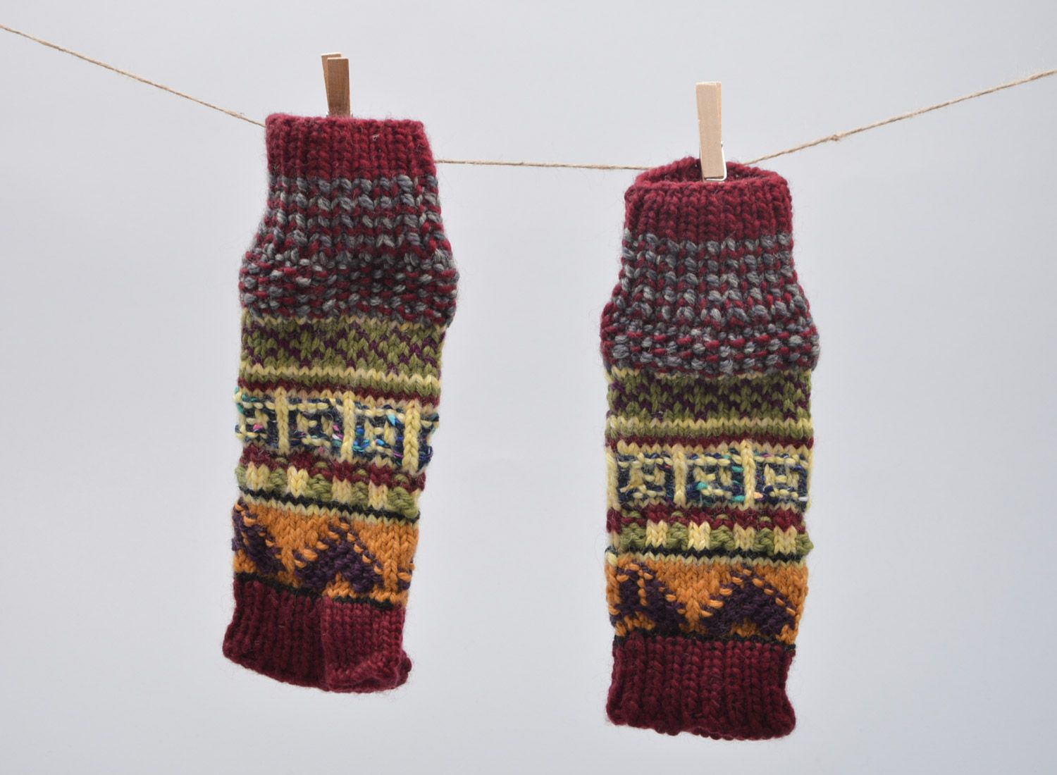 Beautiful handmade fingerless gloves knitted of wool with colorful ornaments photo 5
