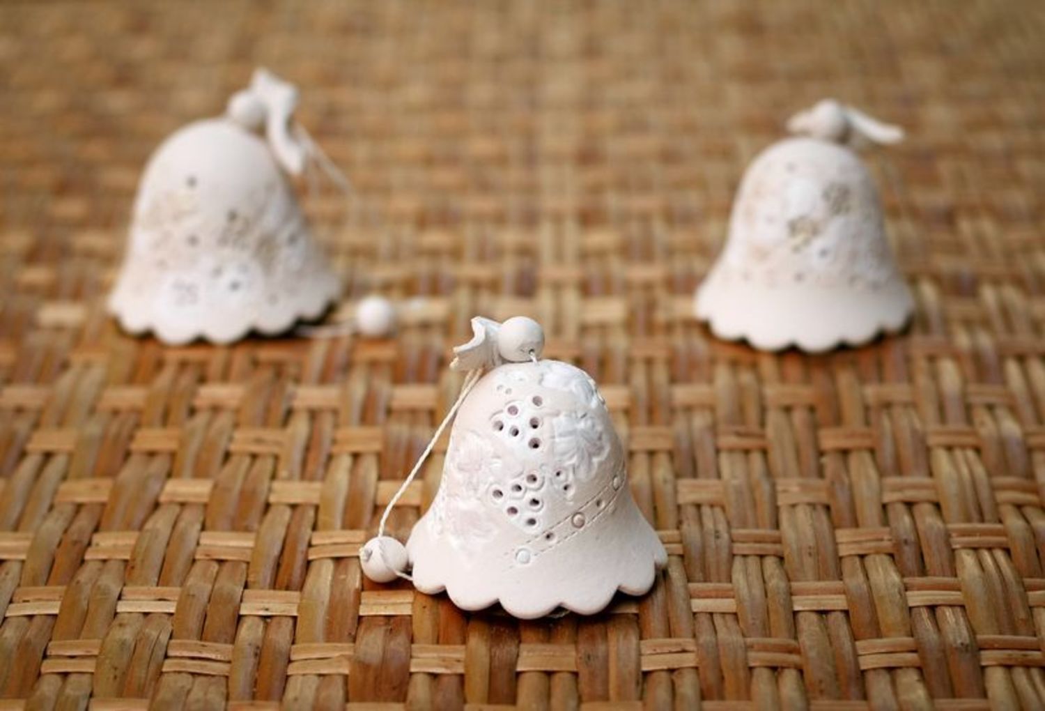 Ceramic bell made from white clay photo 4