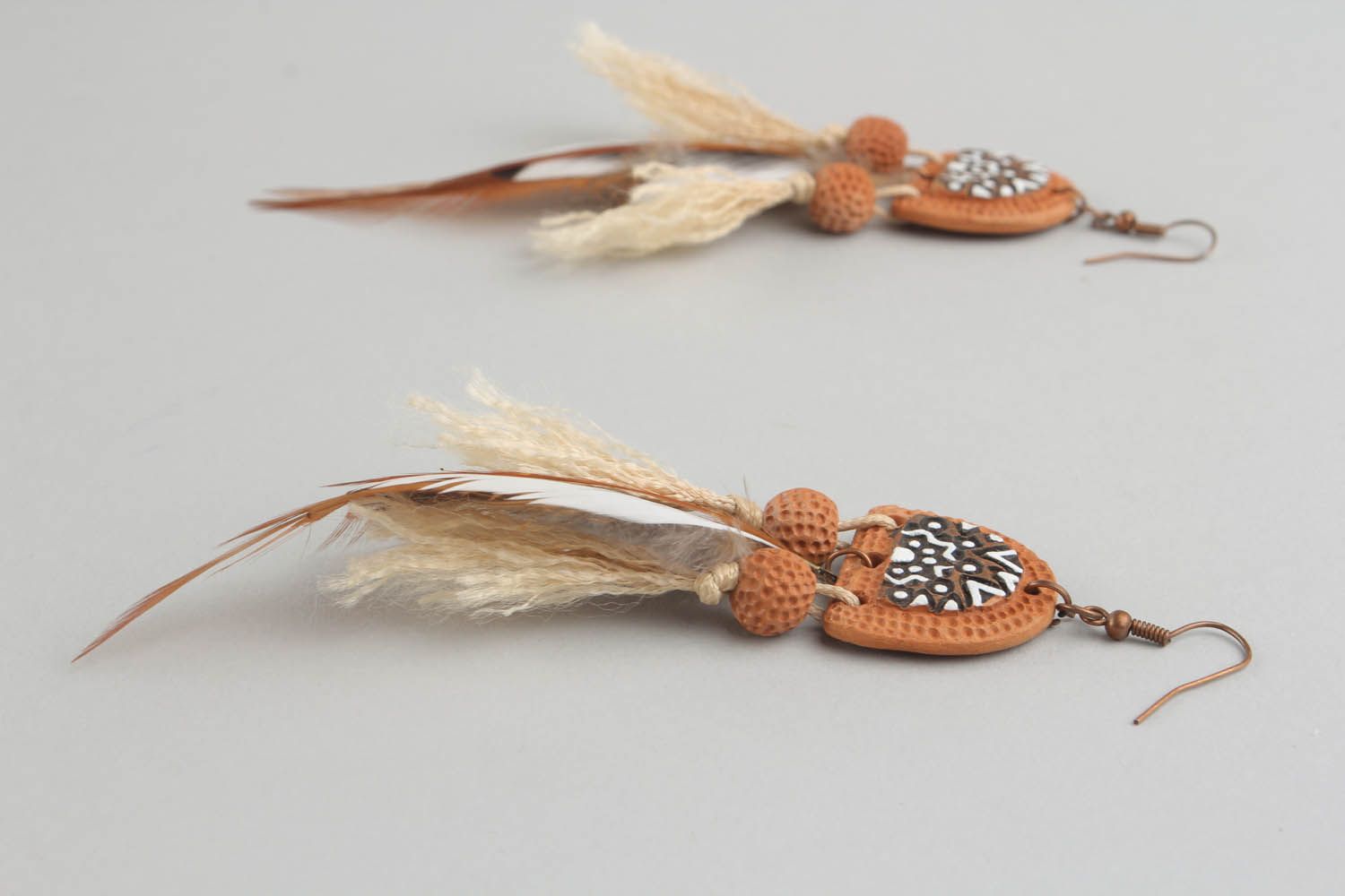 Long earrings with feathers photo 4