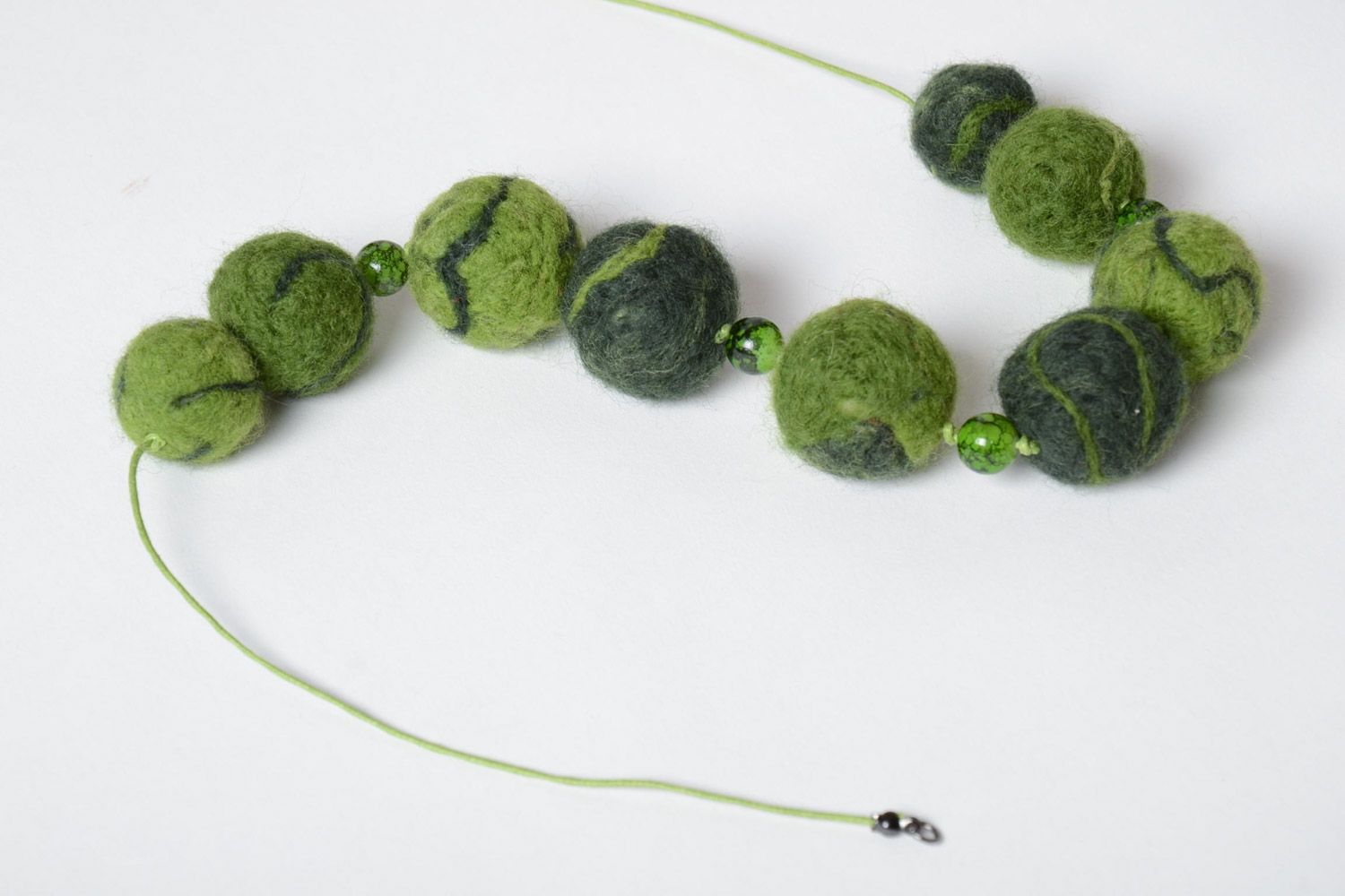 Handmade designer large beaded necklace made of wool using the technique of needle felting in green color photo 4