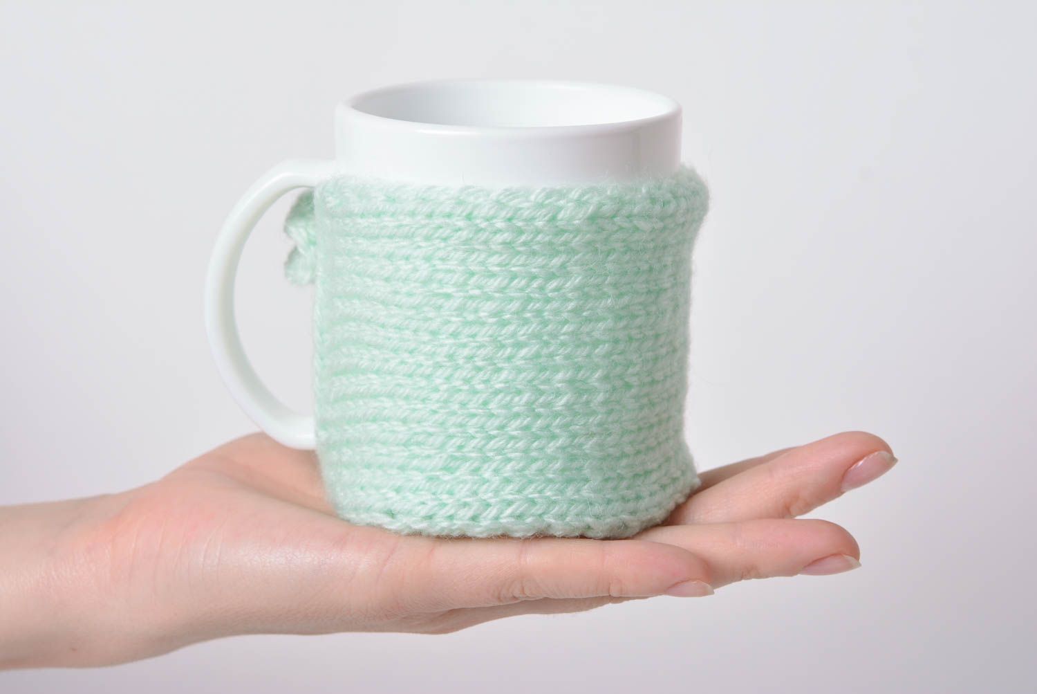 Handmade crocheted beautiful case for cup made of acrylic yarns of mint color photo 3