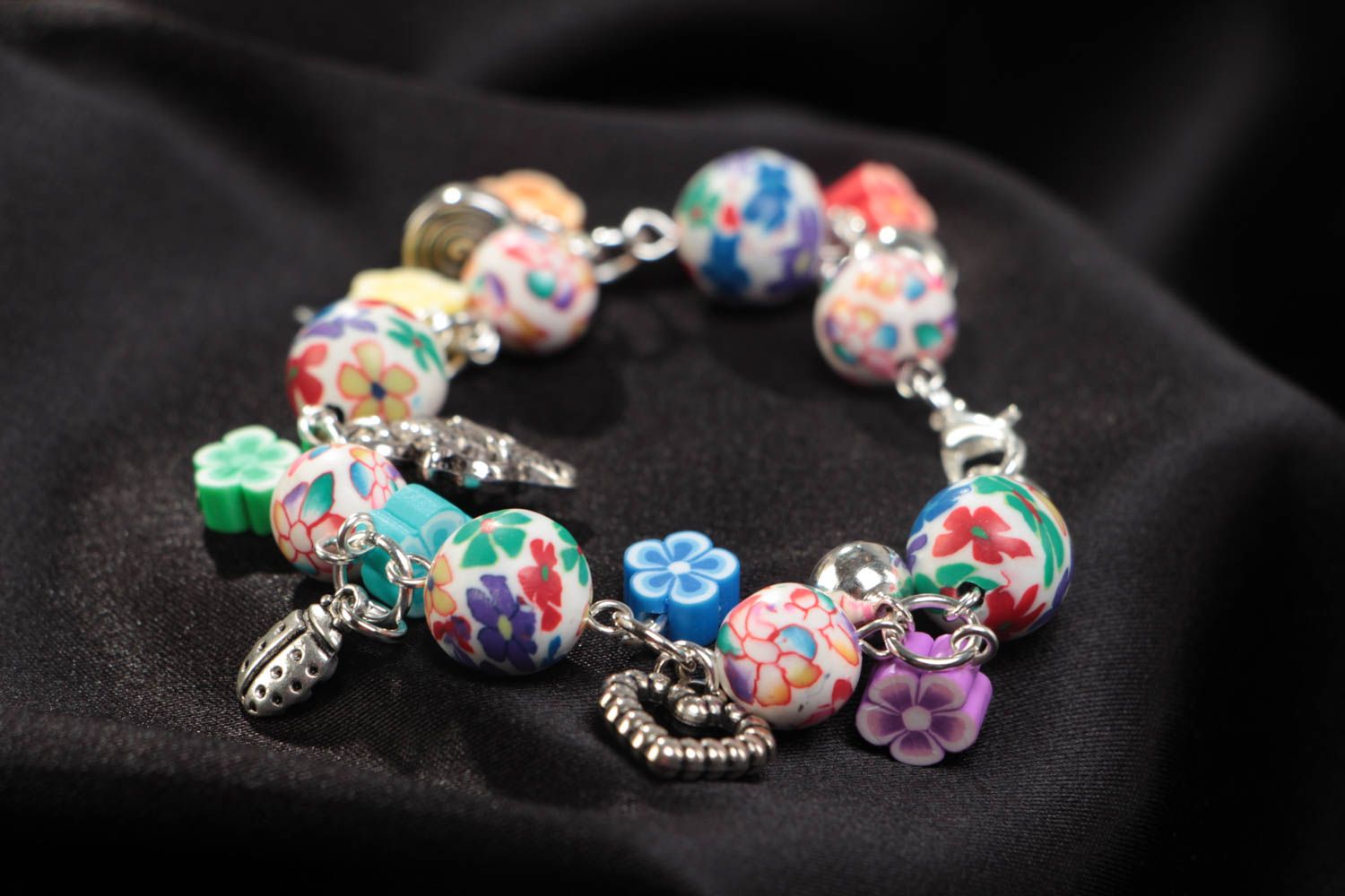Beautiful eye-catching children's handmade plastic bracelet with charms photo 1